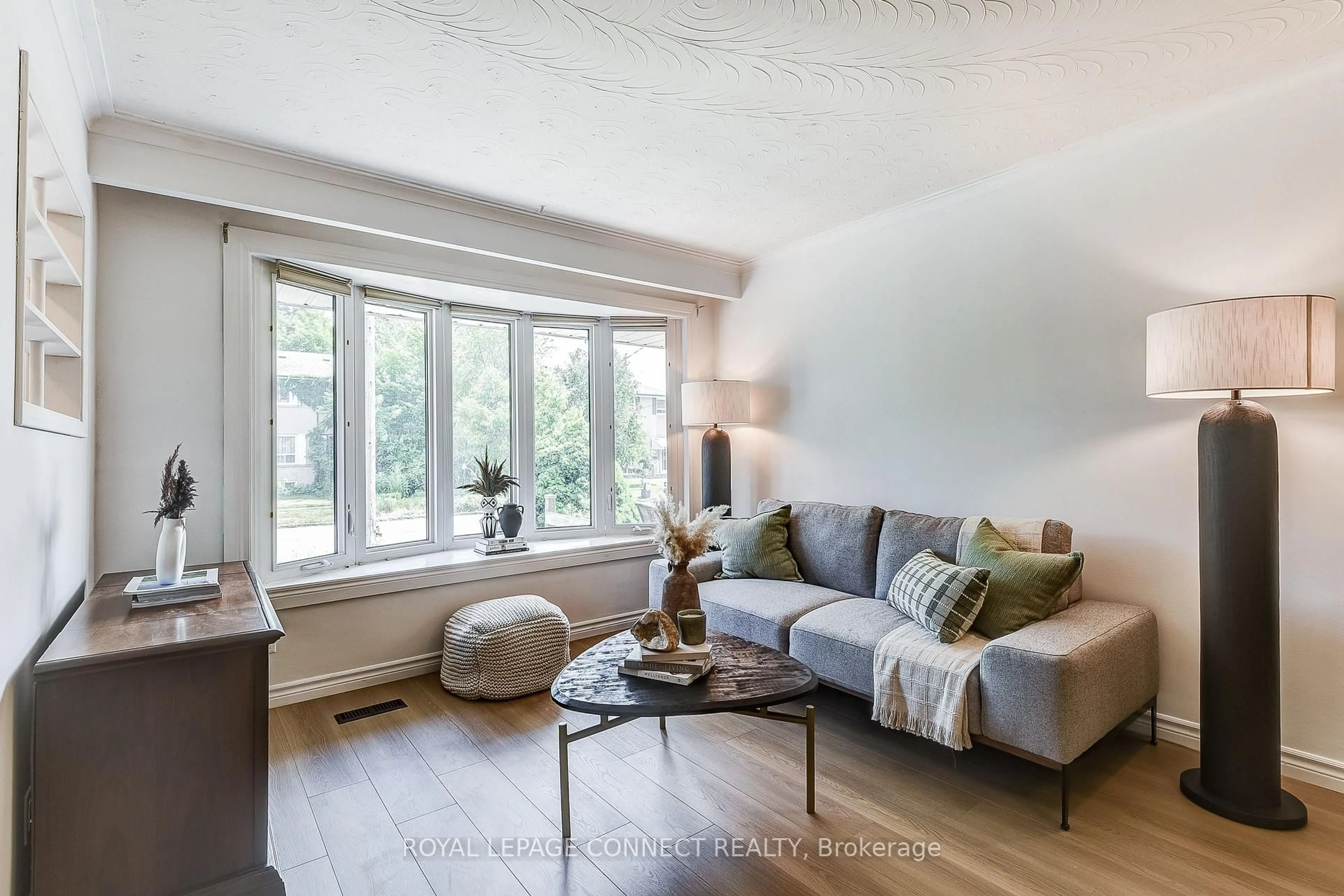 Living room with furniture, wood/laminate floor for 53 Glory Cres, Toronto Ontario M1E 2B9