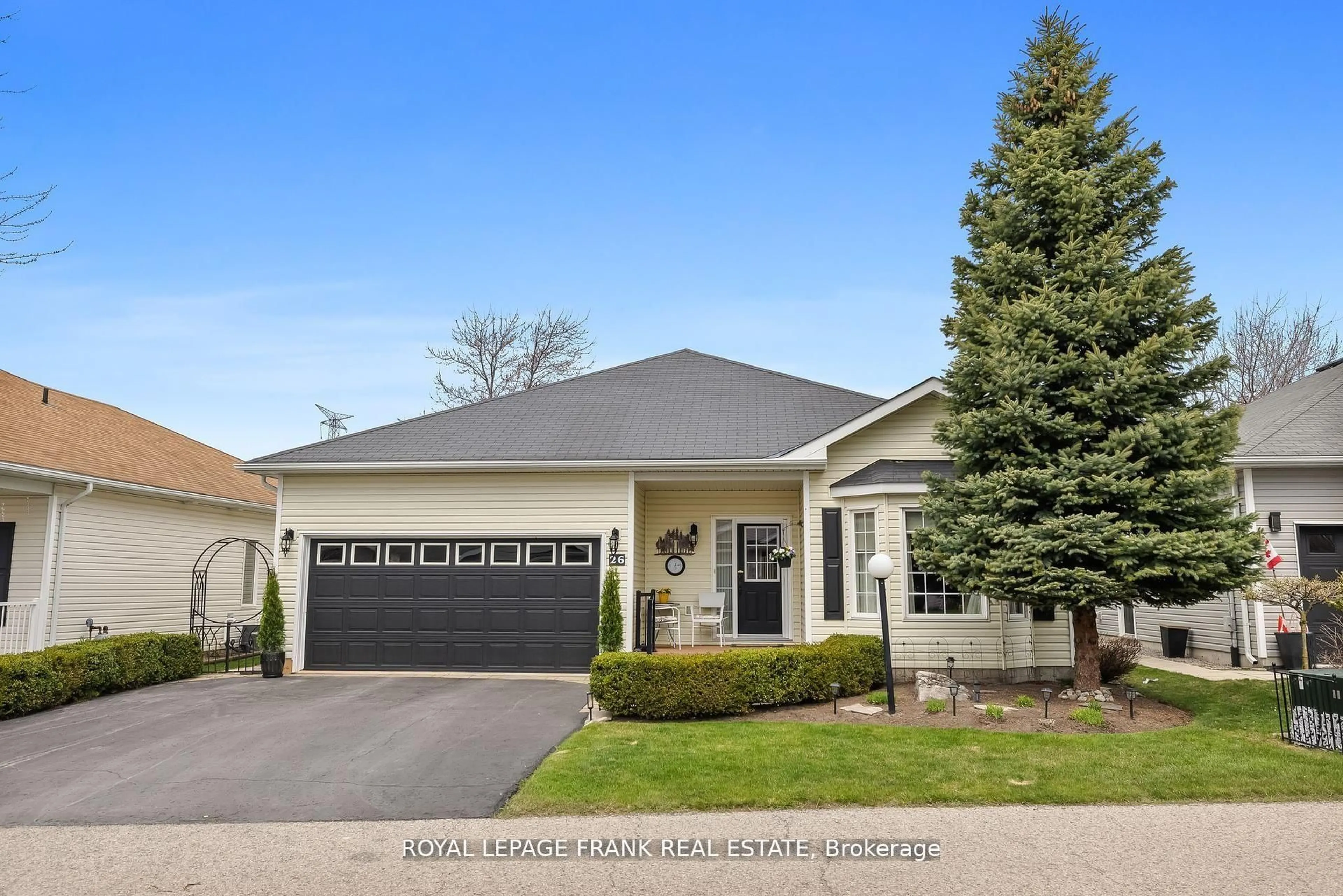 Home with vinyl exterior material, street for 26 Kissingbridge Lane, Clarington Ontario L1B 0B2