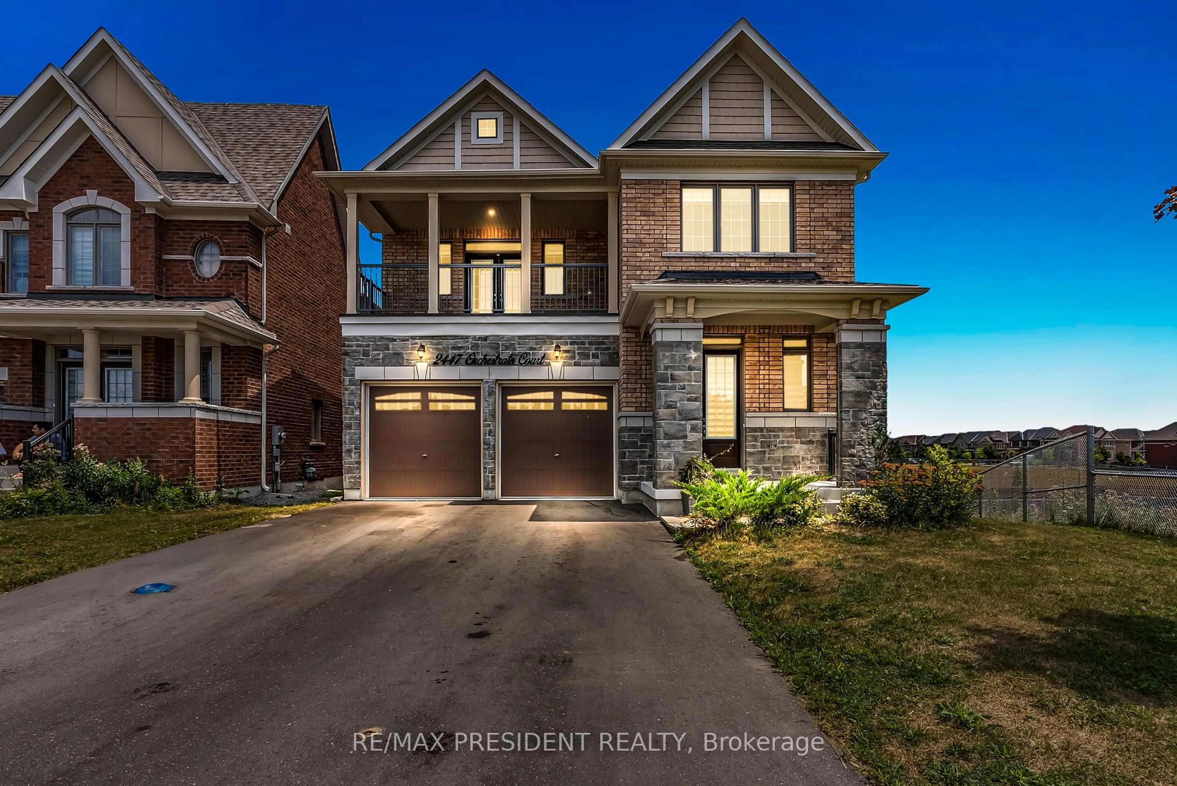 Home with brick exterior material, street for 2447 Orchestrate Crt, Oshawa Ontario L1L 0R3