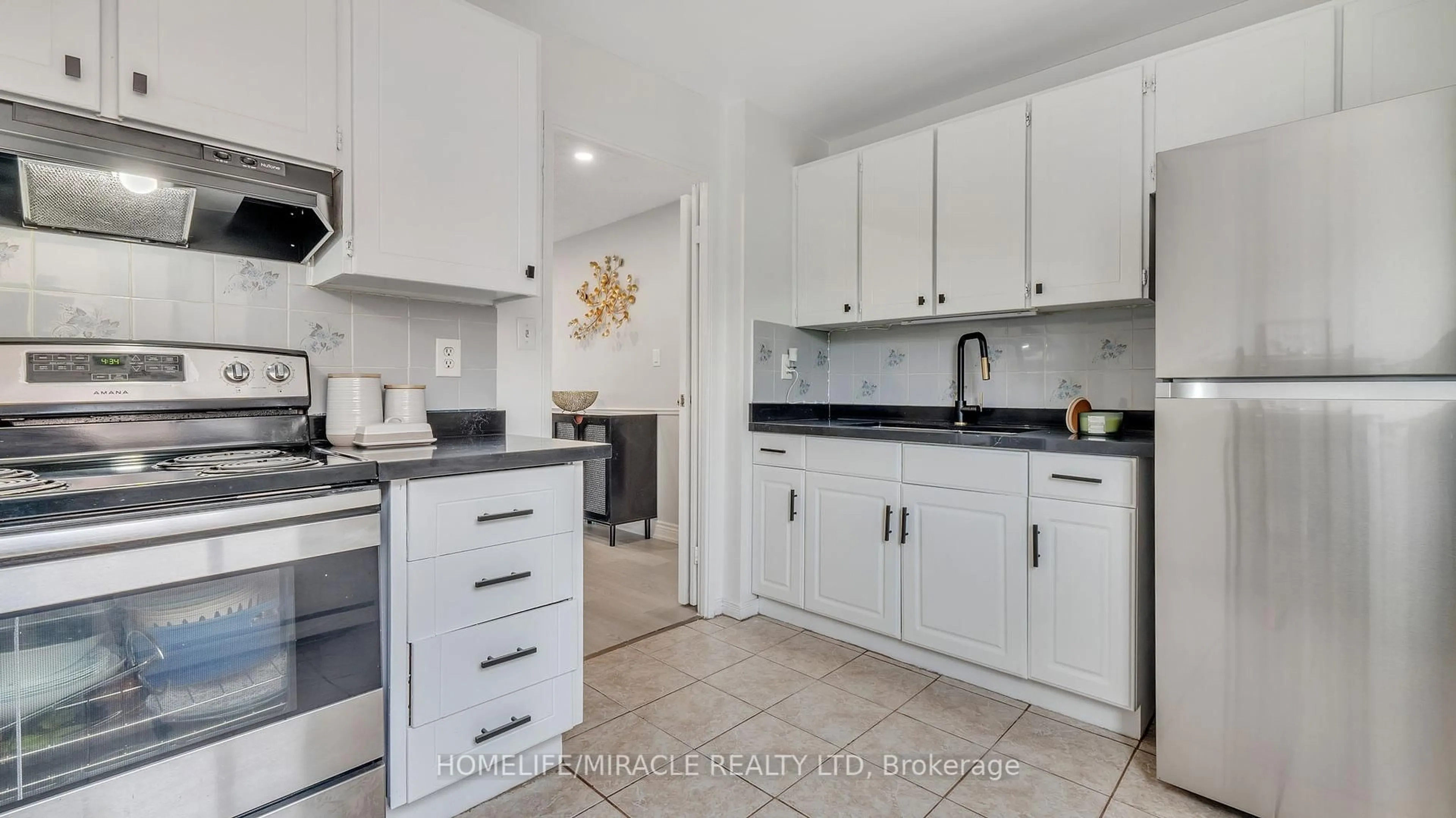 Open concept kitchen, ceramic/tile floor for 91 Muir Dr #54, Toronto Ontario M1M 3T7
