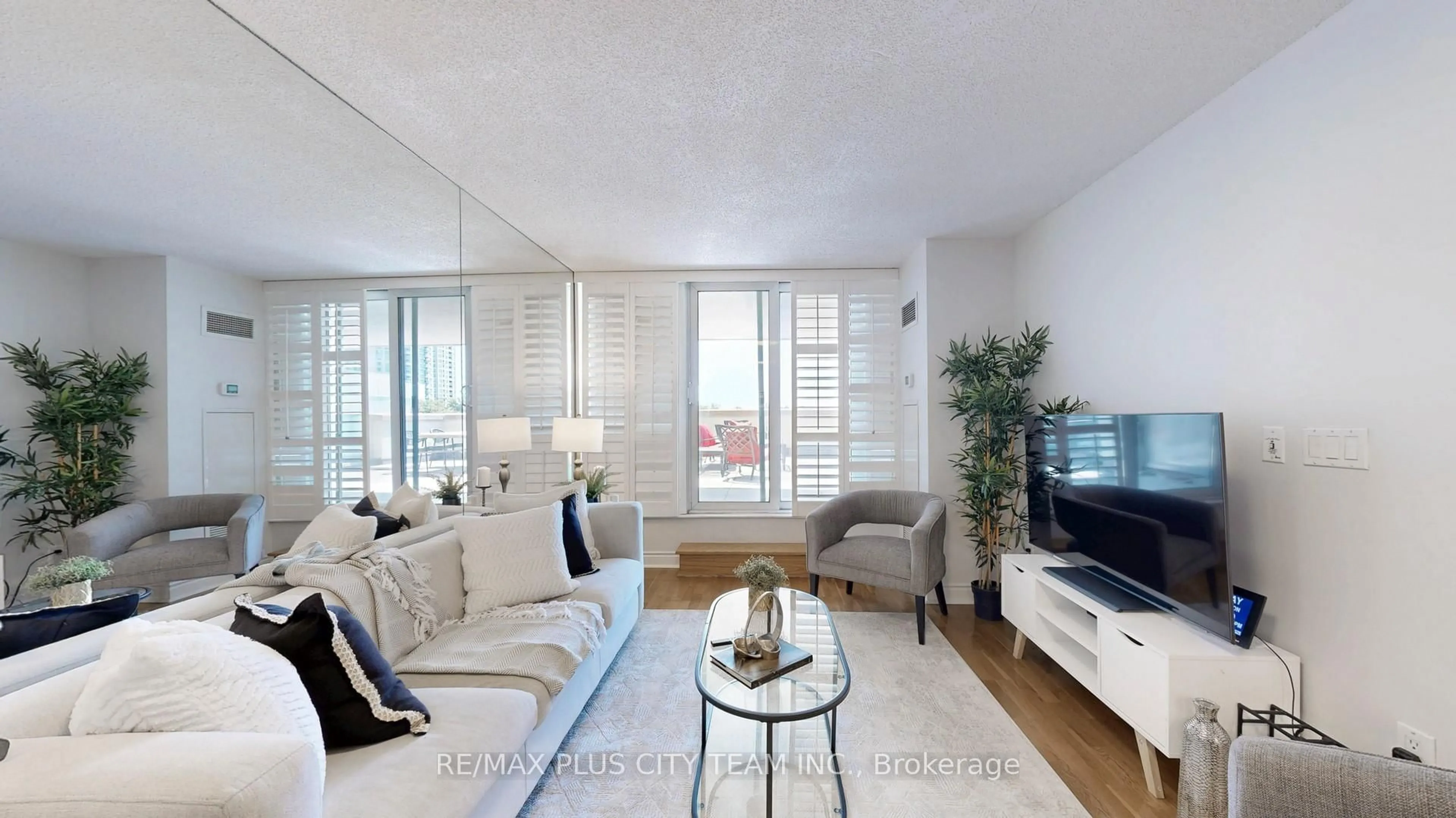 Living room with furniture, wood/laminate floor for 50 Brian Harrison Way #310, Toronto Ontario M1P 5J4