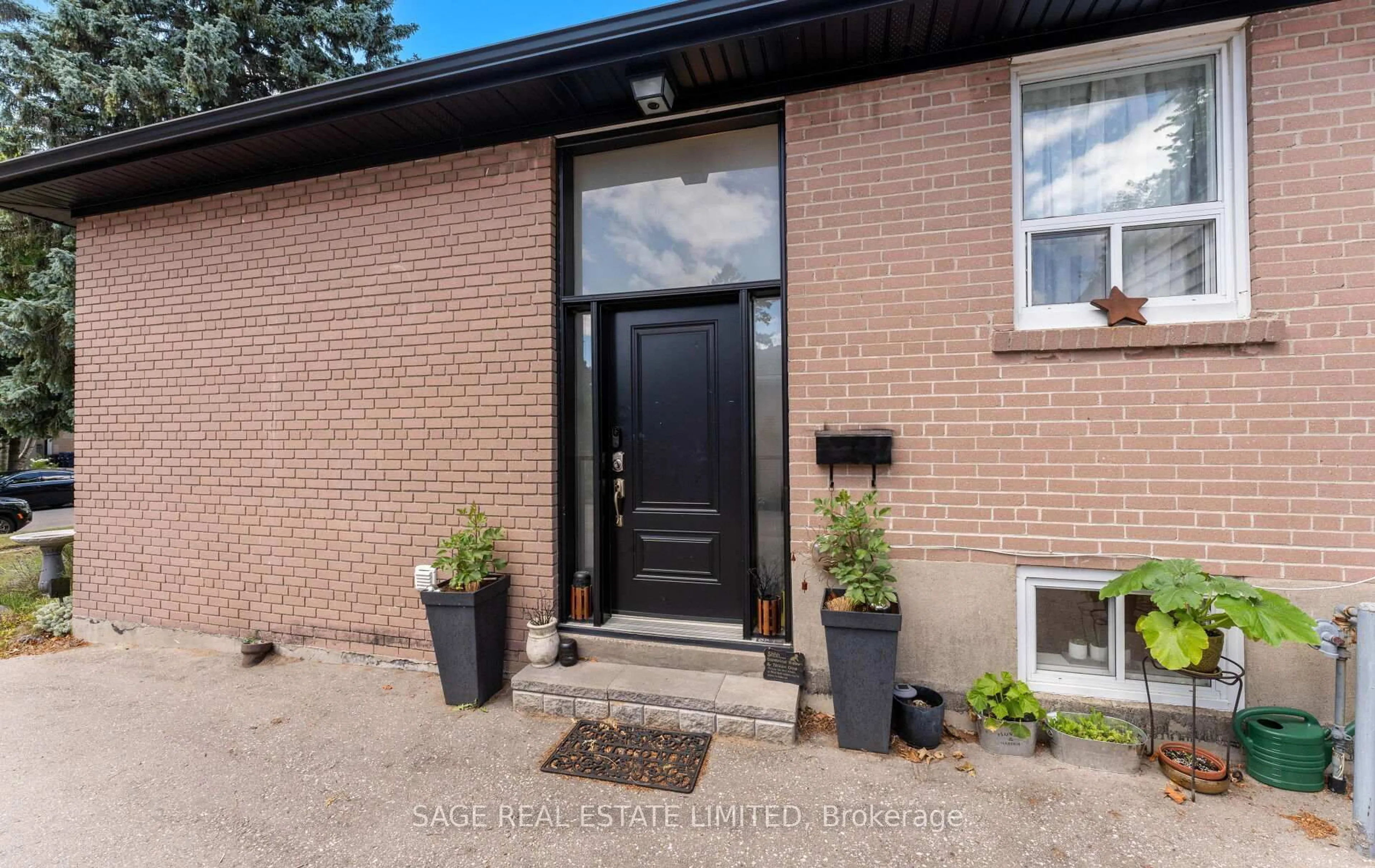 Home with brick exterior material, street for 24 Woodgrove Dr, Toronto Ontario M1E 3J8