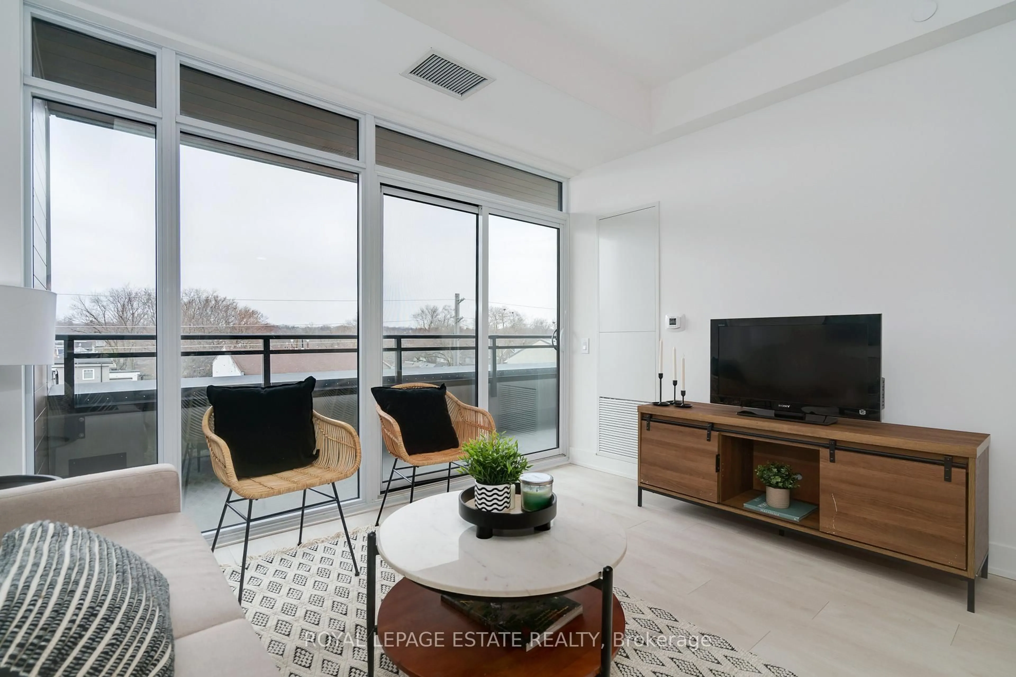 Living room with furniture, unknown for 1285 Queen St #404, Toronto Ontario M4L 0B6