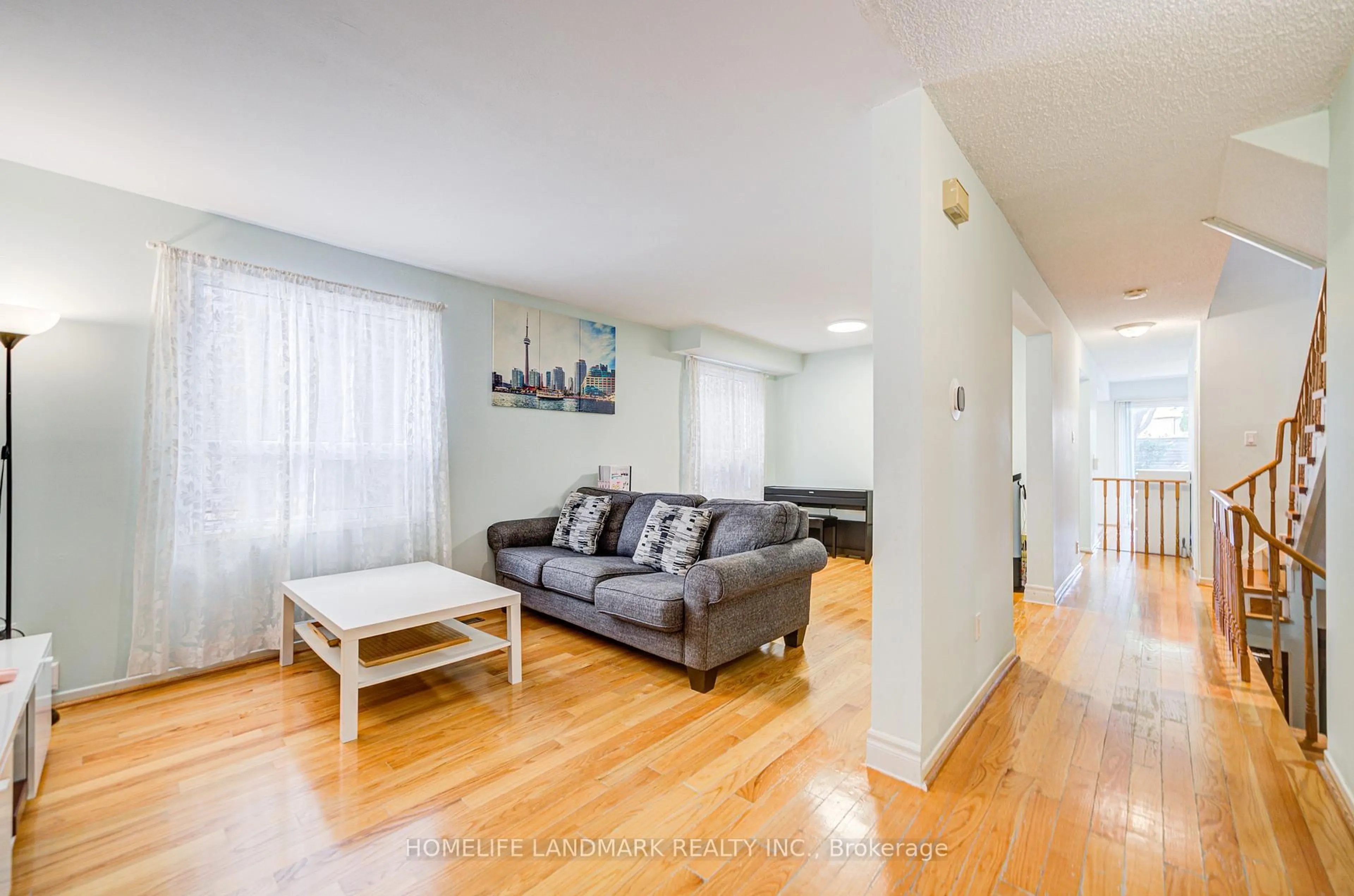 Living room with furniture, wood/laminate floor for 177 Roxanne Cres, Toronto Ontario M1V 4G8