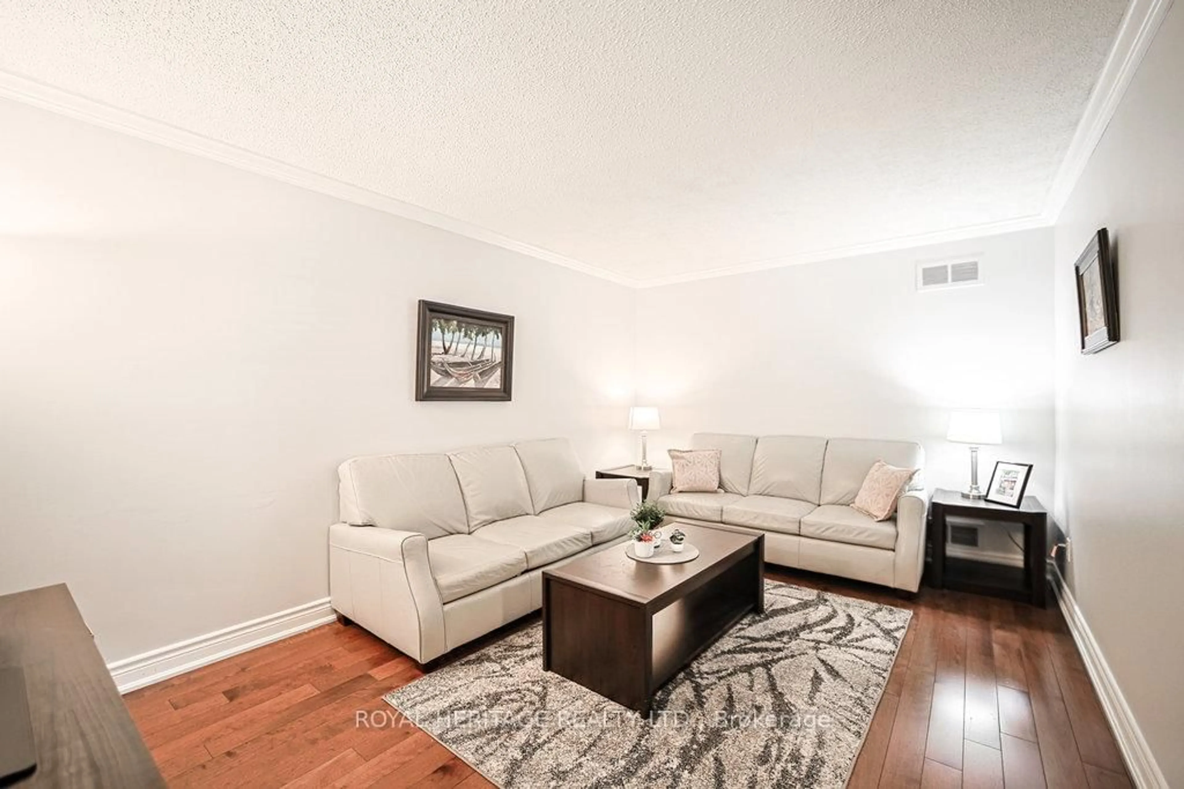 Living room with furniture, wood/laminate floor for 1 Broughton Crt, Whitby Ontario L1N 6Y8