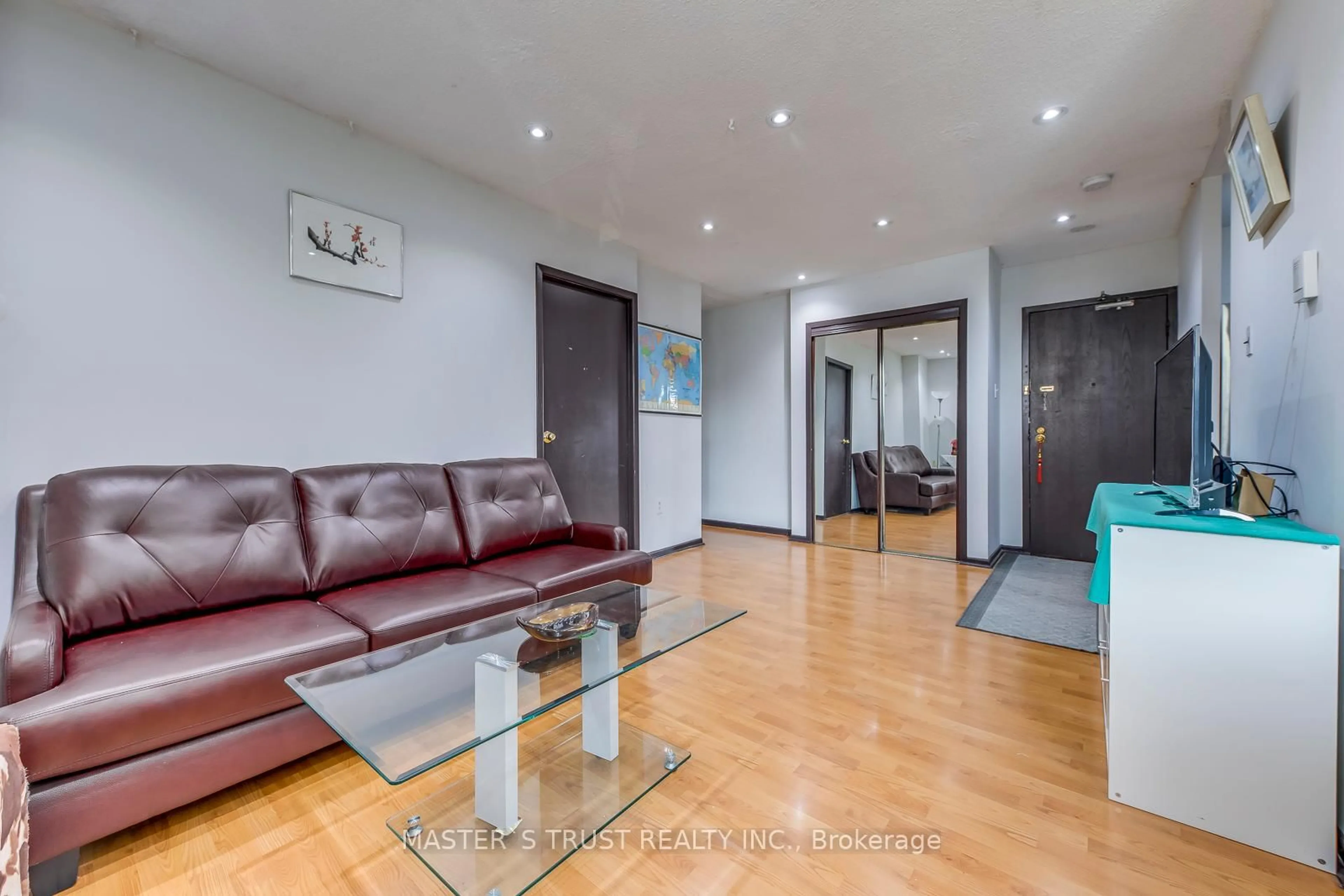 Living room with furniture, wood/laminate floor for 100 Dundalk Dr #214, Toronto Ontario M1P 4V2