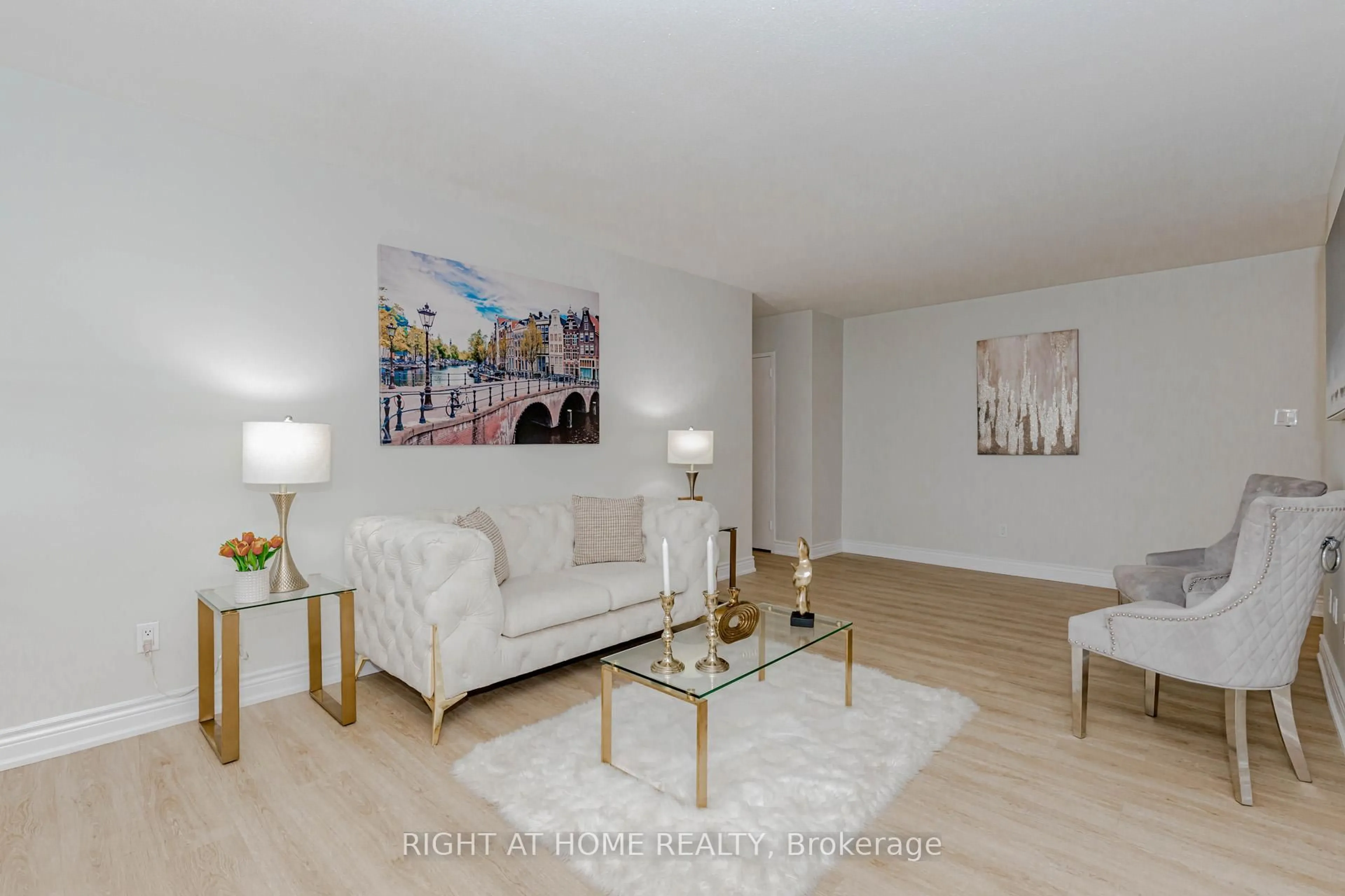 Living room with furniture, wood/laminate floor for 3311 Kingston Rd #707, Toronto Ontario M1M 1R1