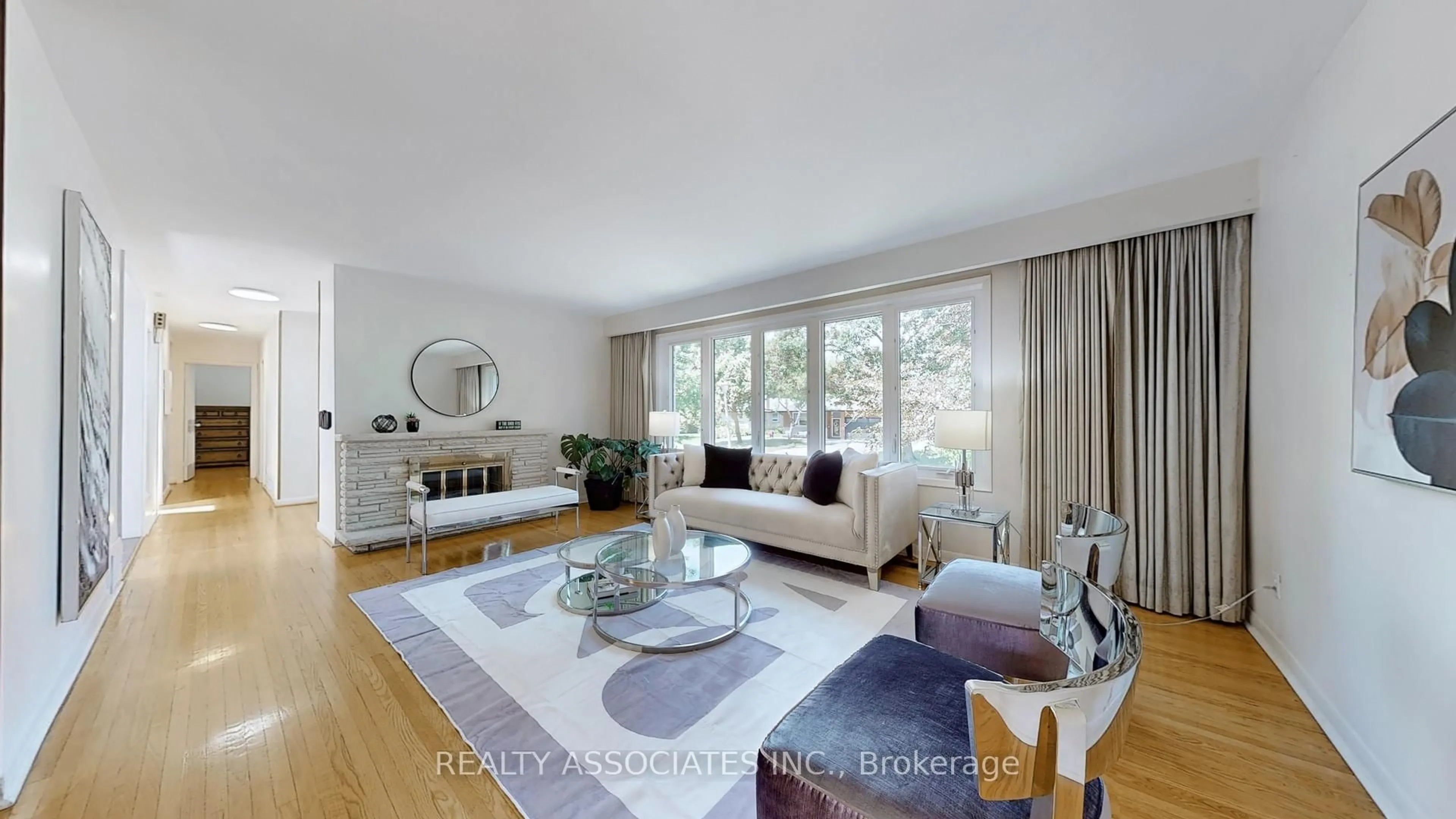 Living room with furniture, wood/laminate floor for 79 Toynbee Tr, Toronto Ontario M1E 1G1