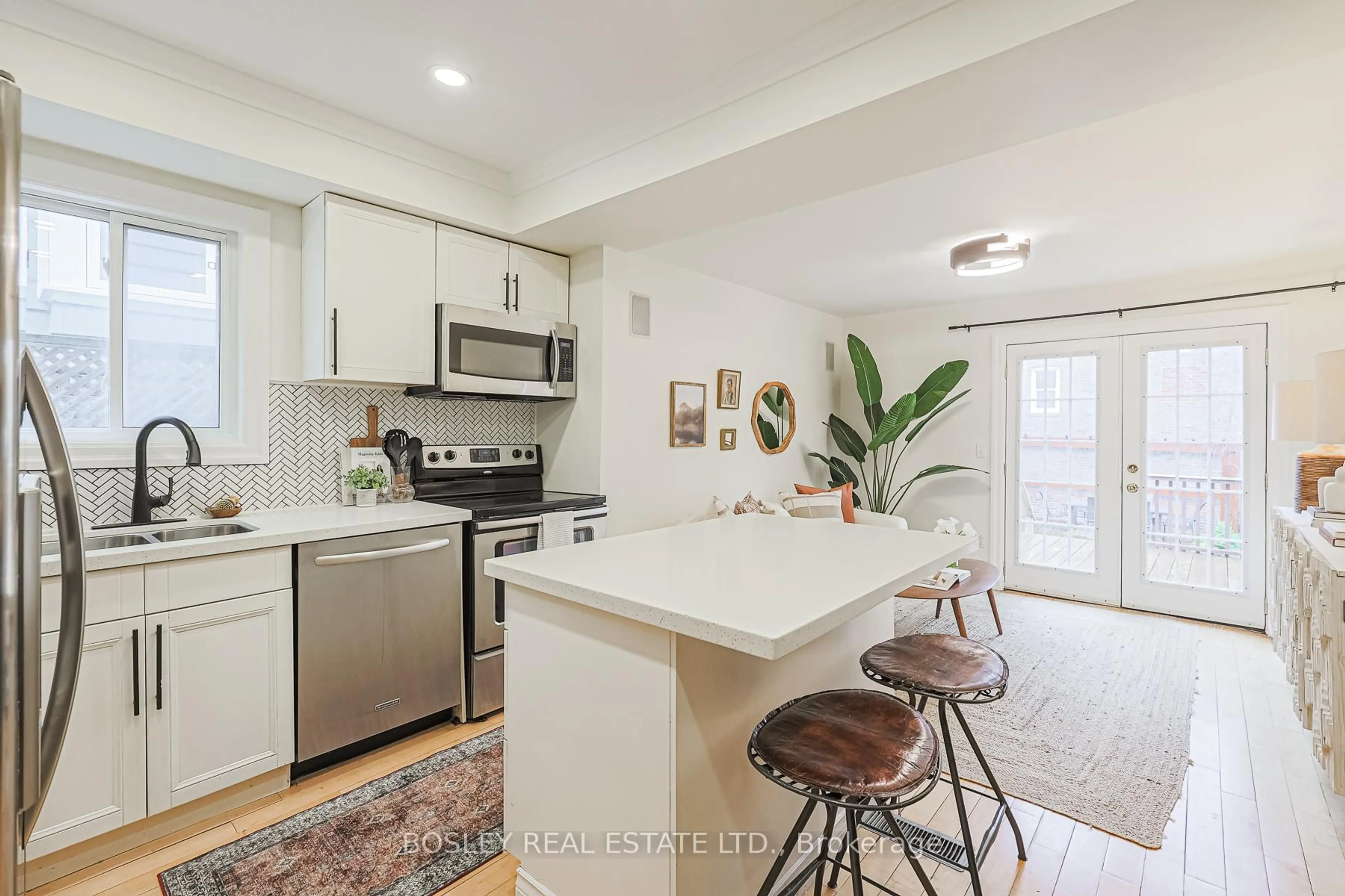 Open concept kitchen, ceramic/tile floor for 245 Kenilworth Ave, Toronto Ontario M4L 3S7