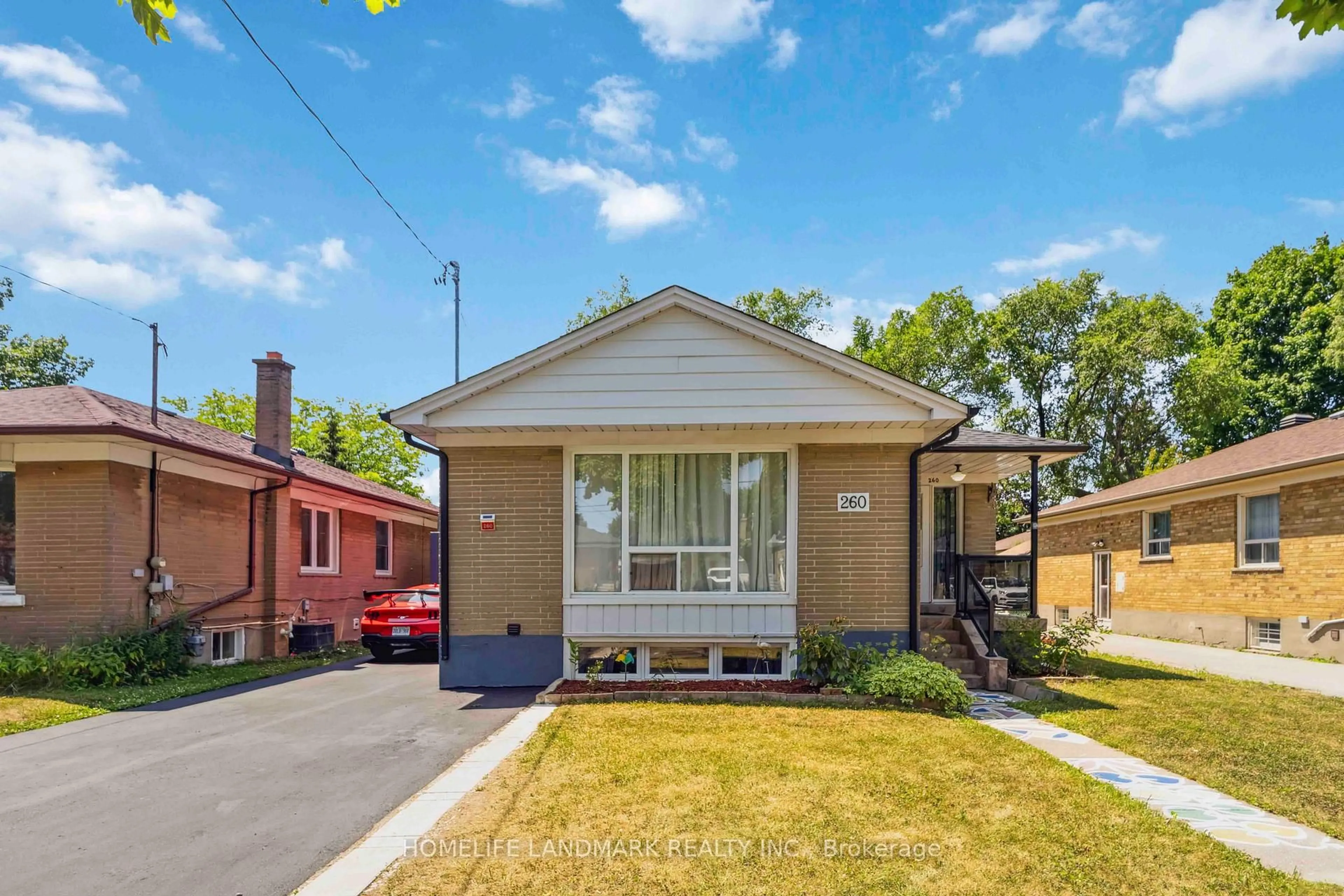Home with brick exterior material, street for 260 Chine Dr, Toronto Ontario M1M 2L8