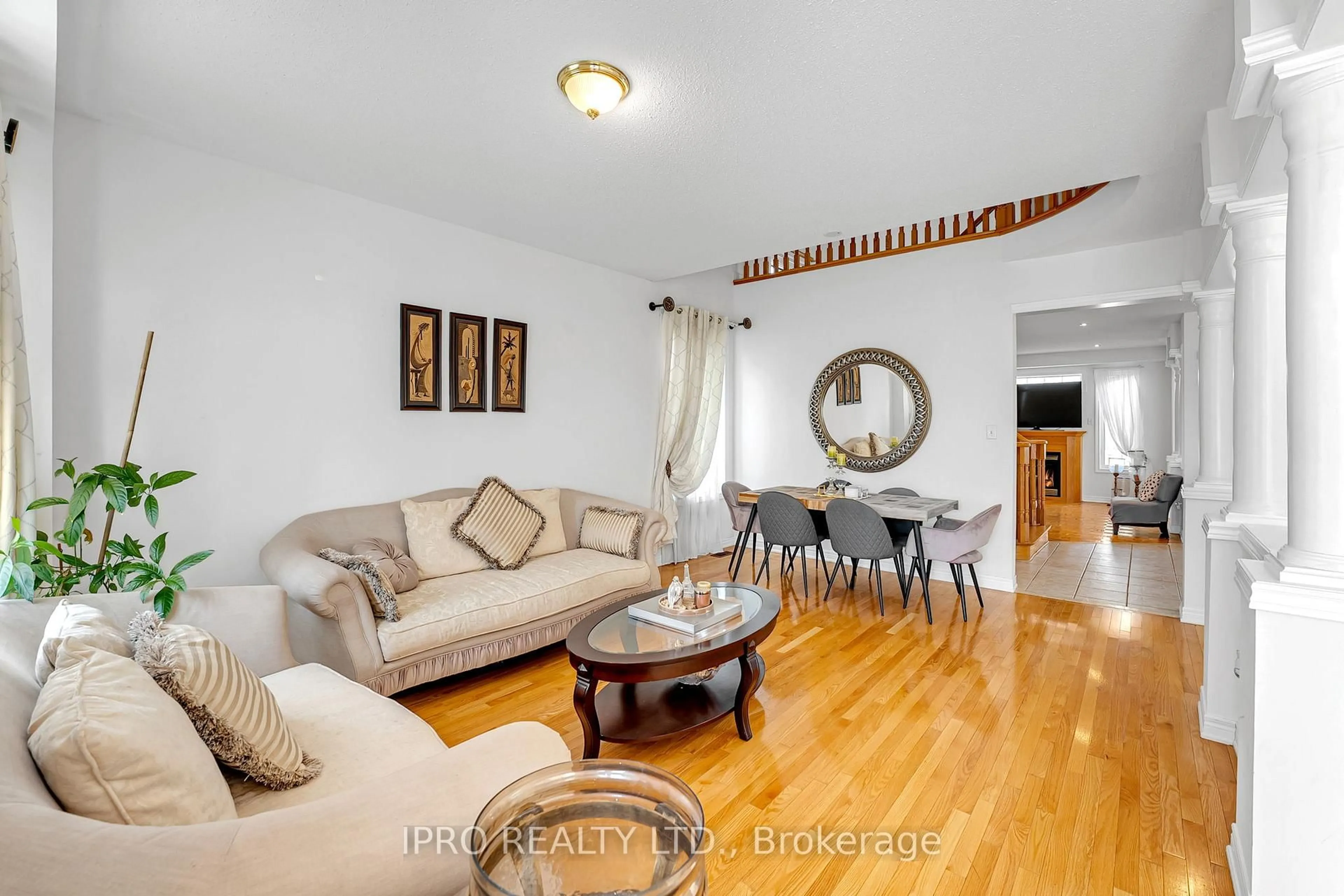 Living room with furniture, wood/laminate floor for 89 Bonnydon Cres, Toronto Ontario M1B 6H8