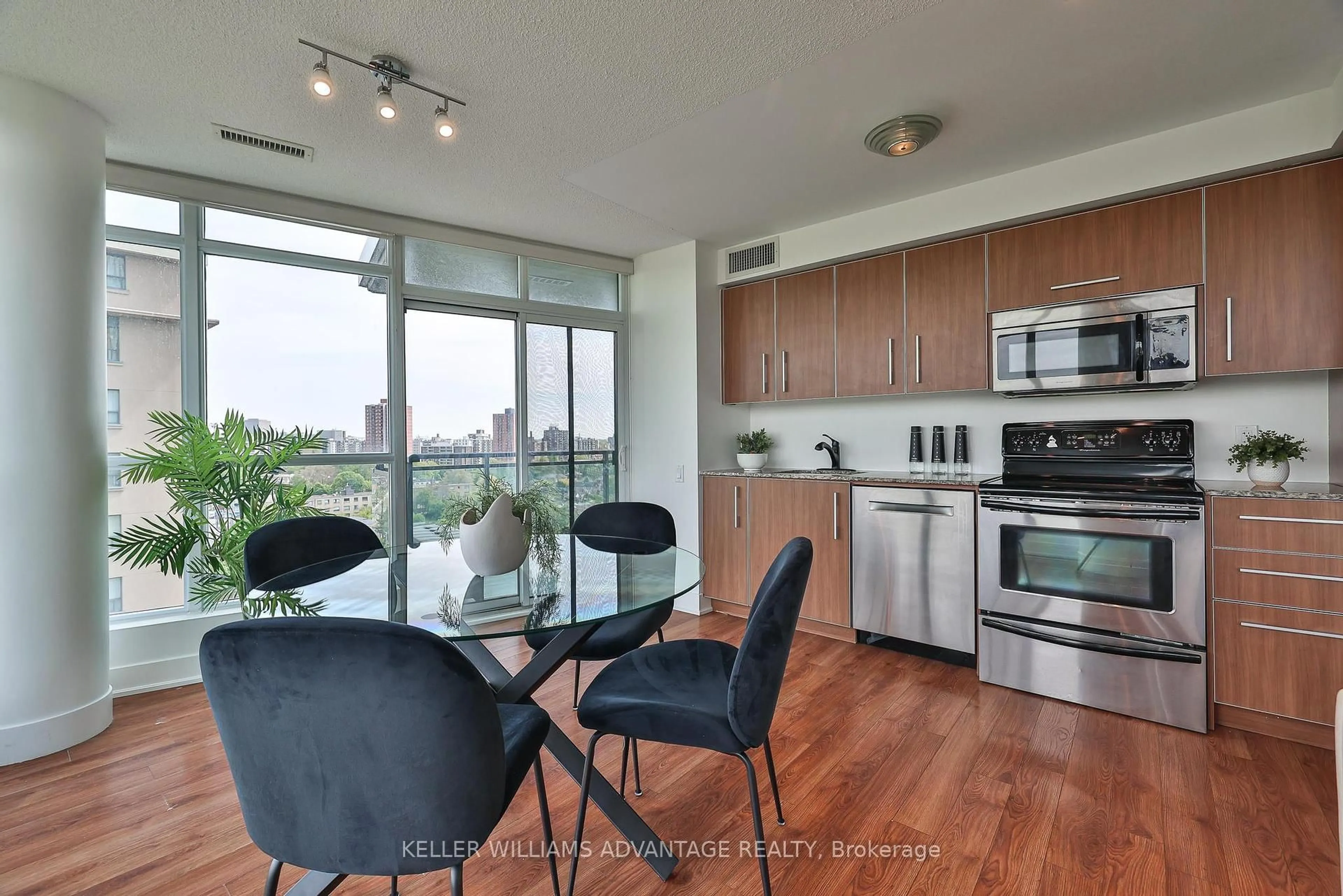 Open concept kitchen, wood/laminate floor for 1048 Broadview Ave #1208, Toronto Ontario M4K 2B8