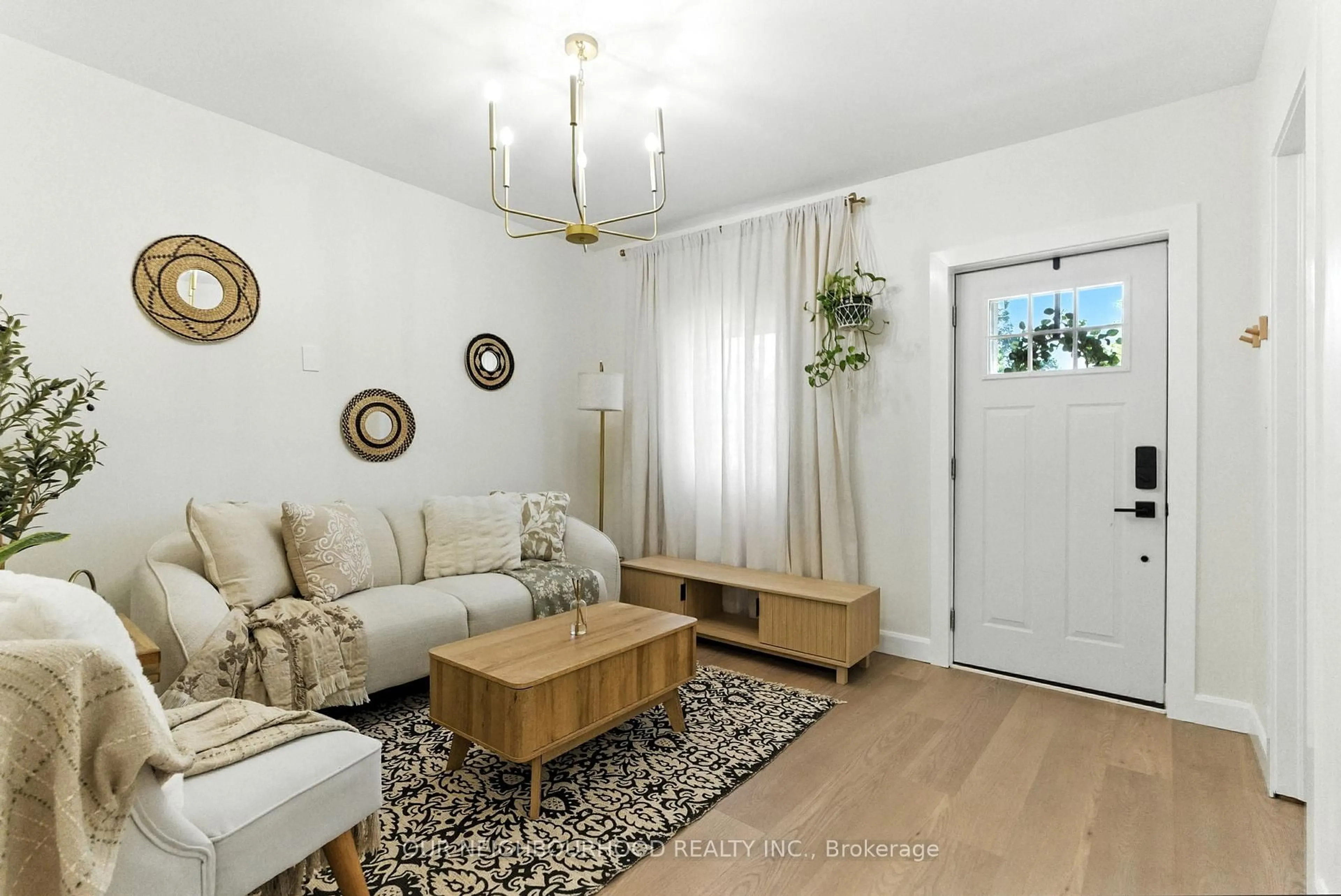 Living room with furniture, wood/laminate floor for 319 Division St, Oshawa Ontario L1G 5M6