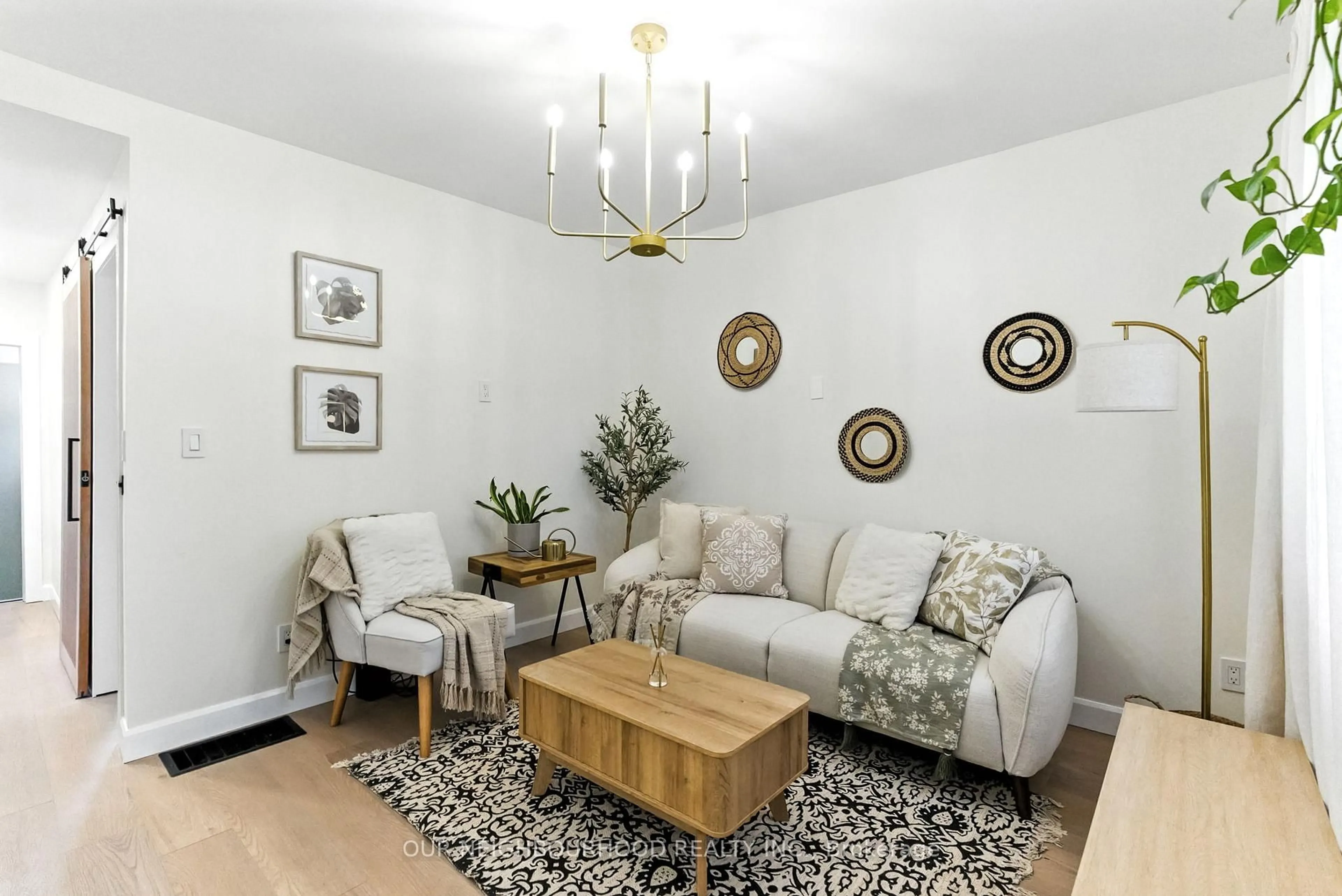 Living room with furniture, wood/laminate floor for 319 Division St, Oshawa Ontario L1G 5M6