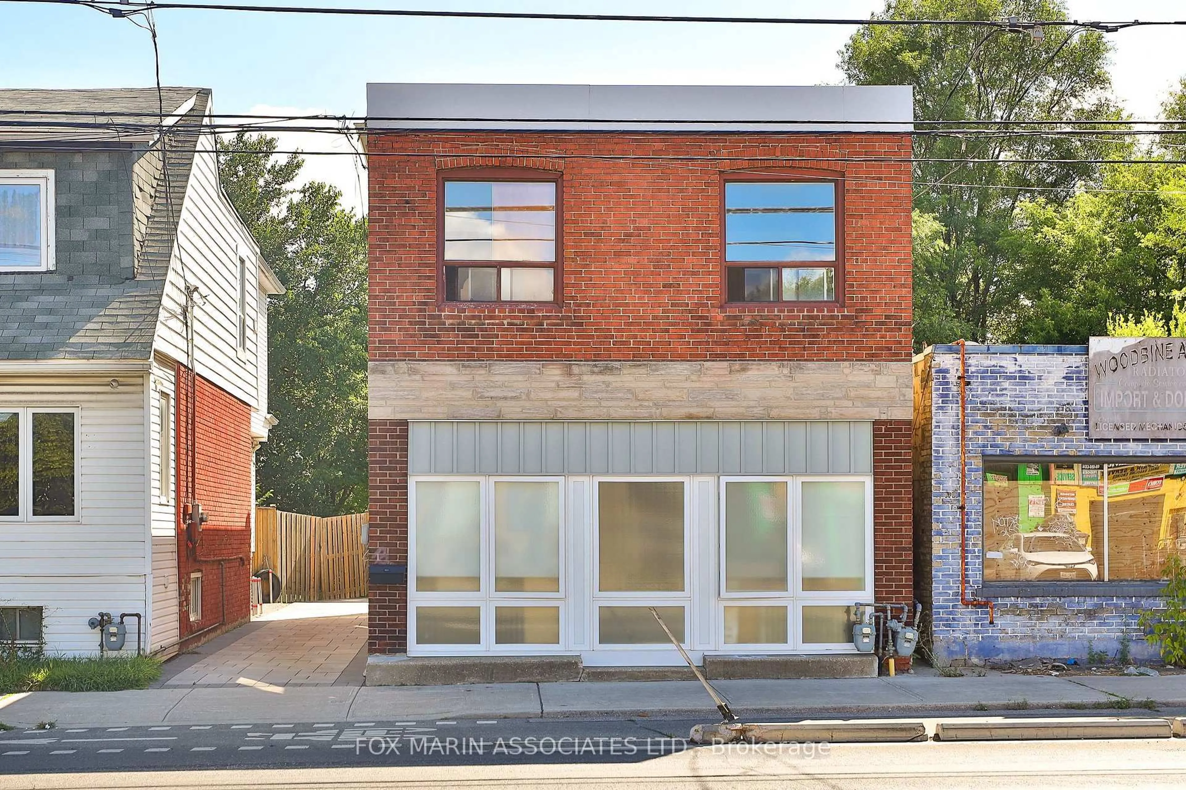 Home with brick exterior material, building for 1215 Woodbine Ave, Toronto Ontario M4C 4E1
