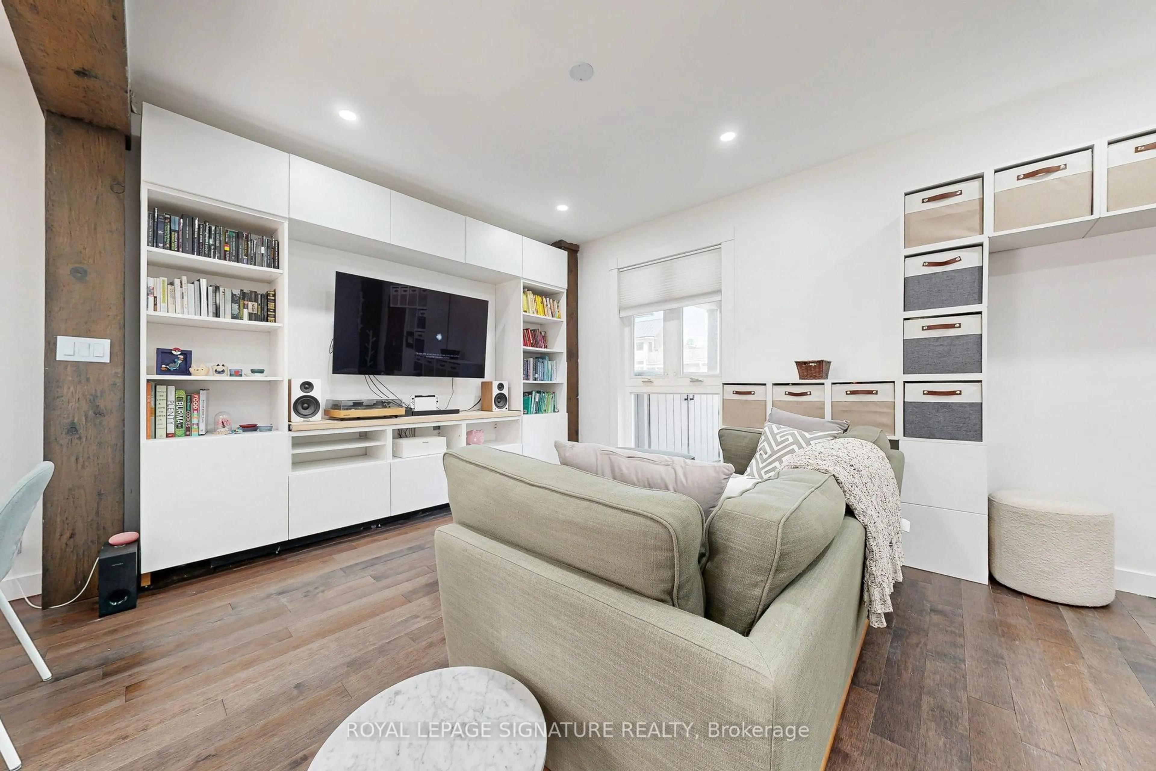 Living room with furniture, wood/laminate floor for 17 Hunter St, Toronto Ontario M4J 1C1