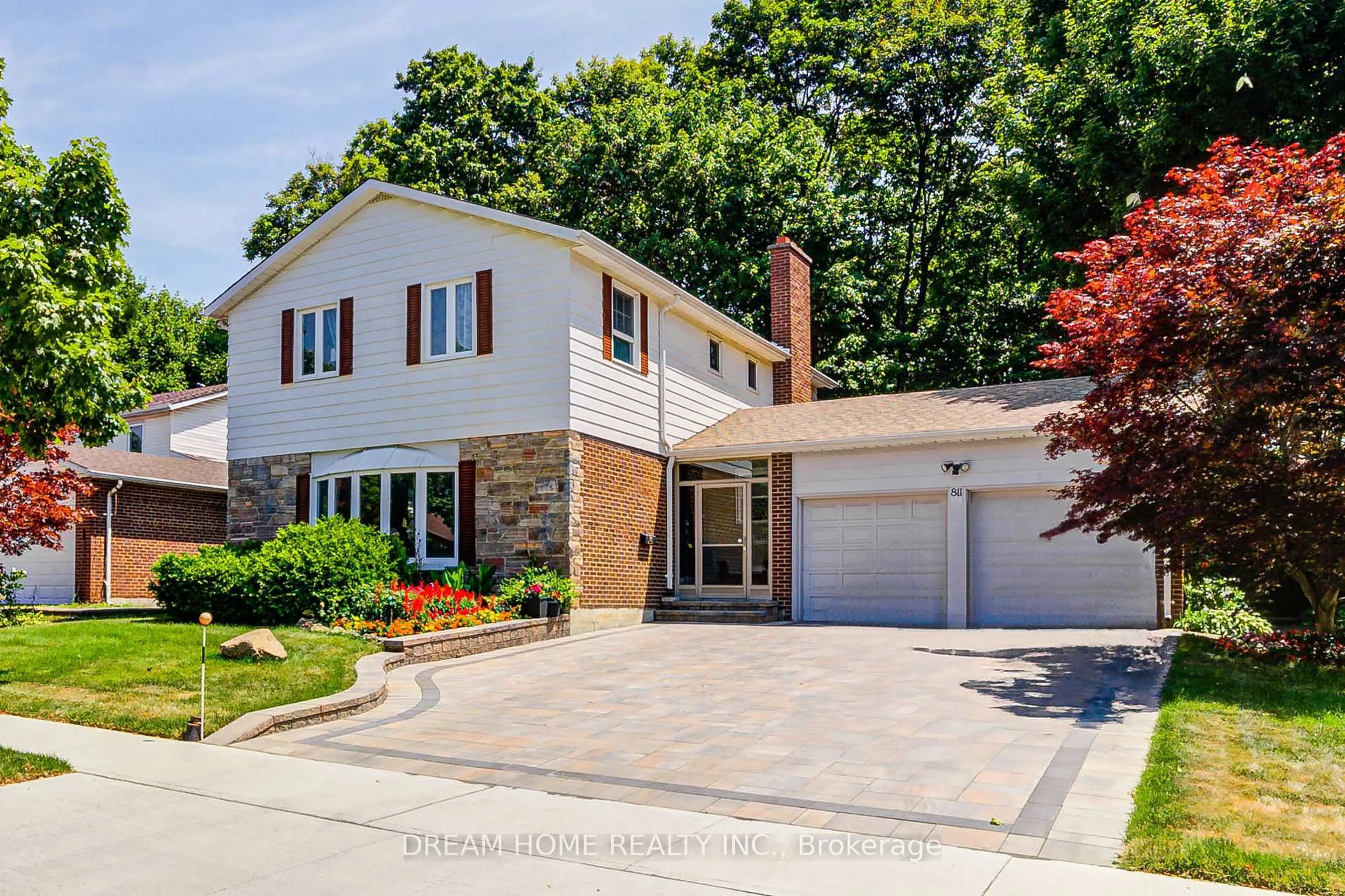 Home with brick exterior material, street for 811 Huntingwood Dr, Toronto Ontario M1T 2L8