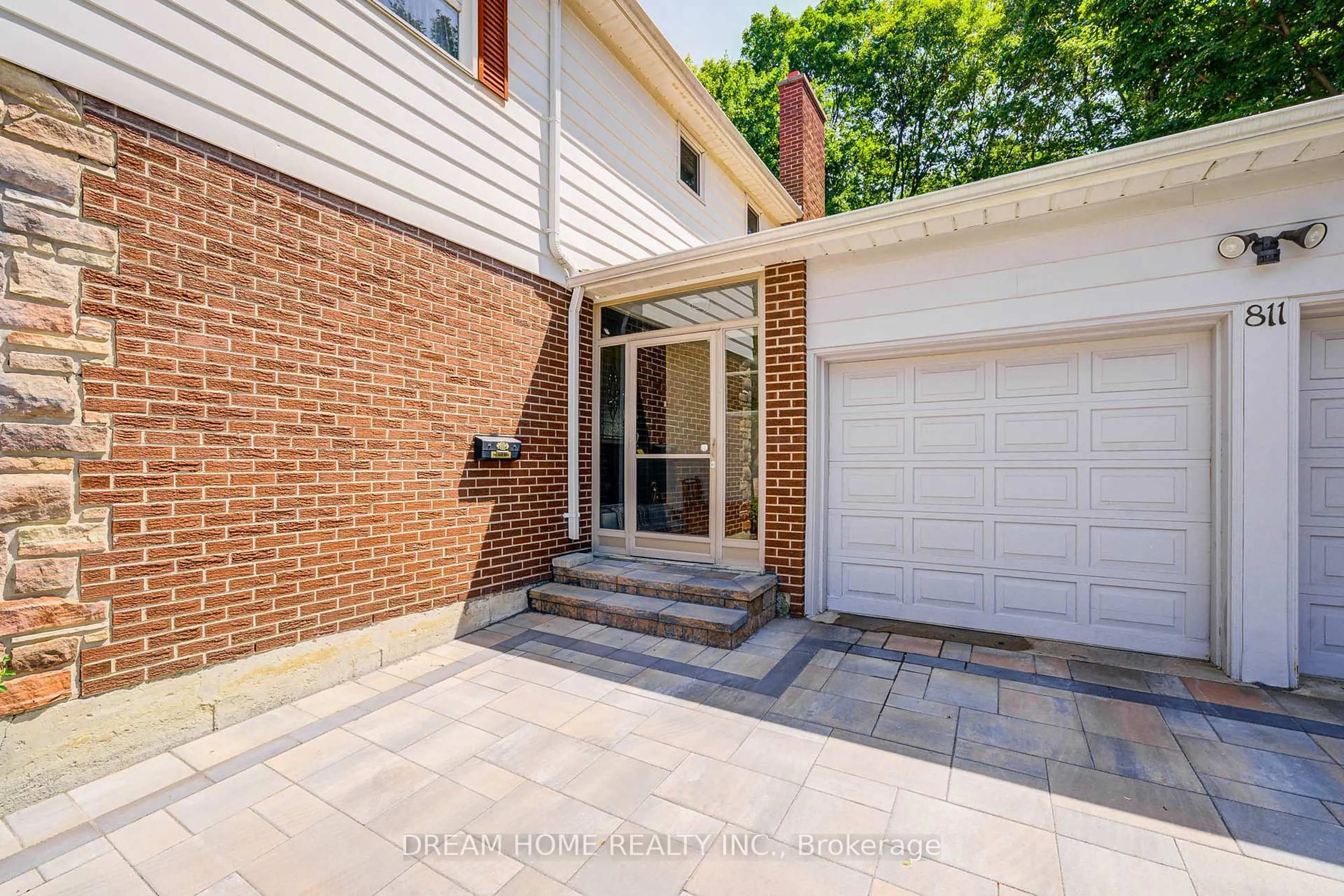 Home with brick exterior material, street for 811 Huntingwood Dr, Toronto Ontario M1T 2L8