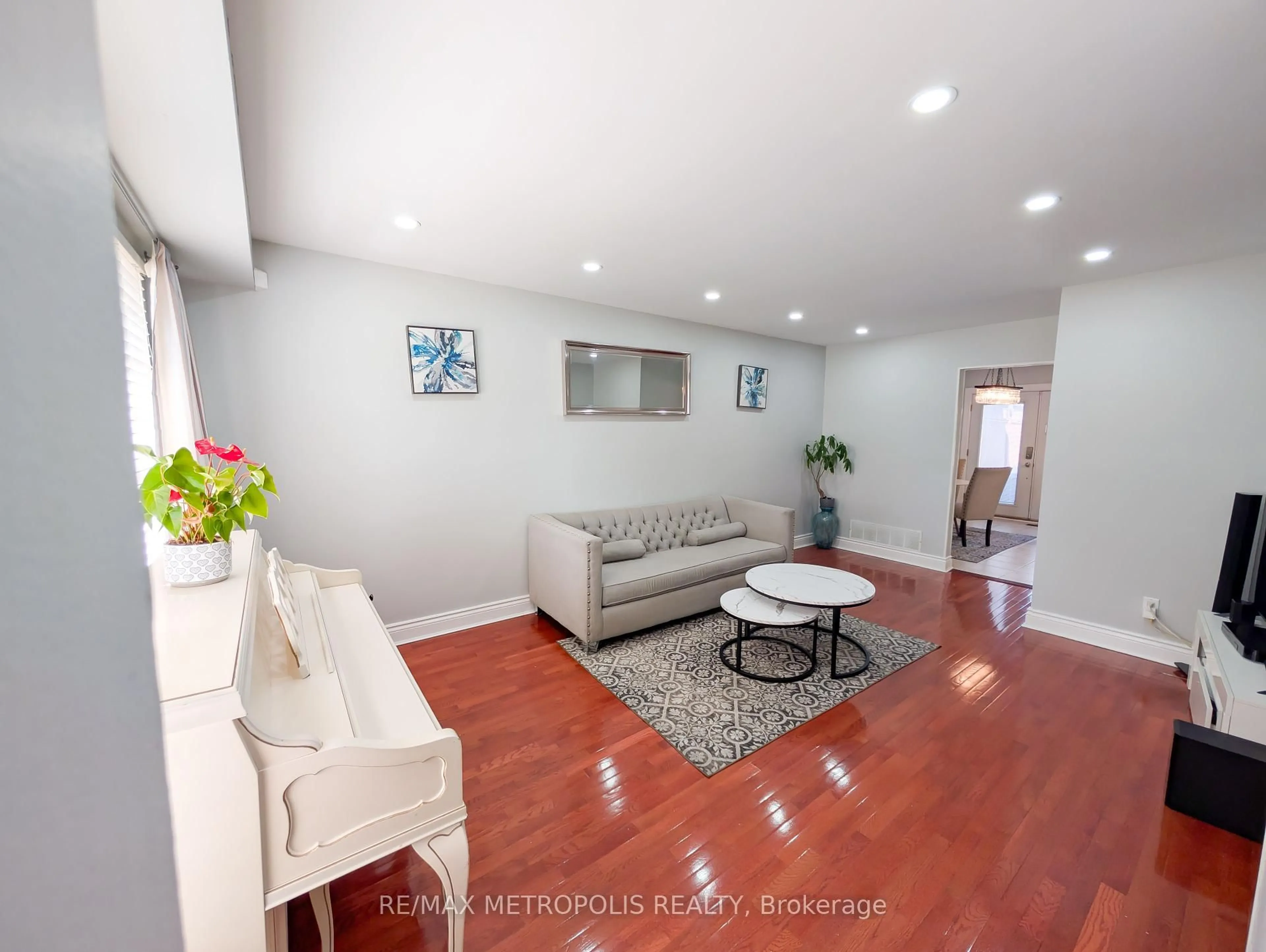 Living room with furniture, wood/laminate floor for 359 Calvert Crt, Oshawa Ontario L1J 6X7