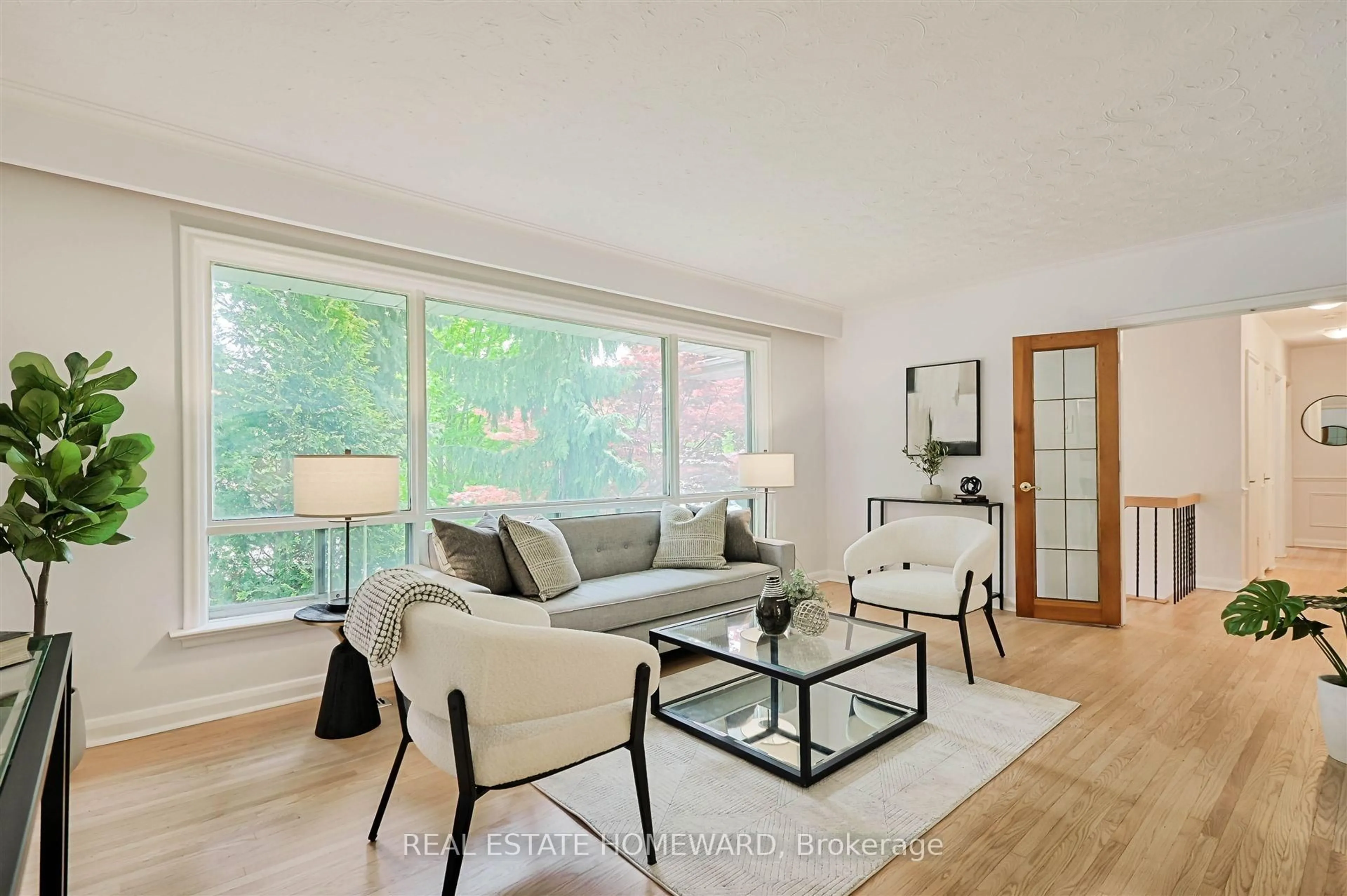 Living room with furniture, wood/laminate floor for 8 Burnview Cres, Toronto Ontario M1H 1B5