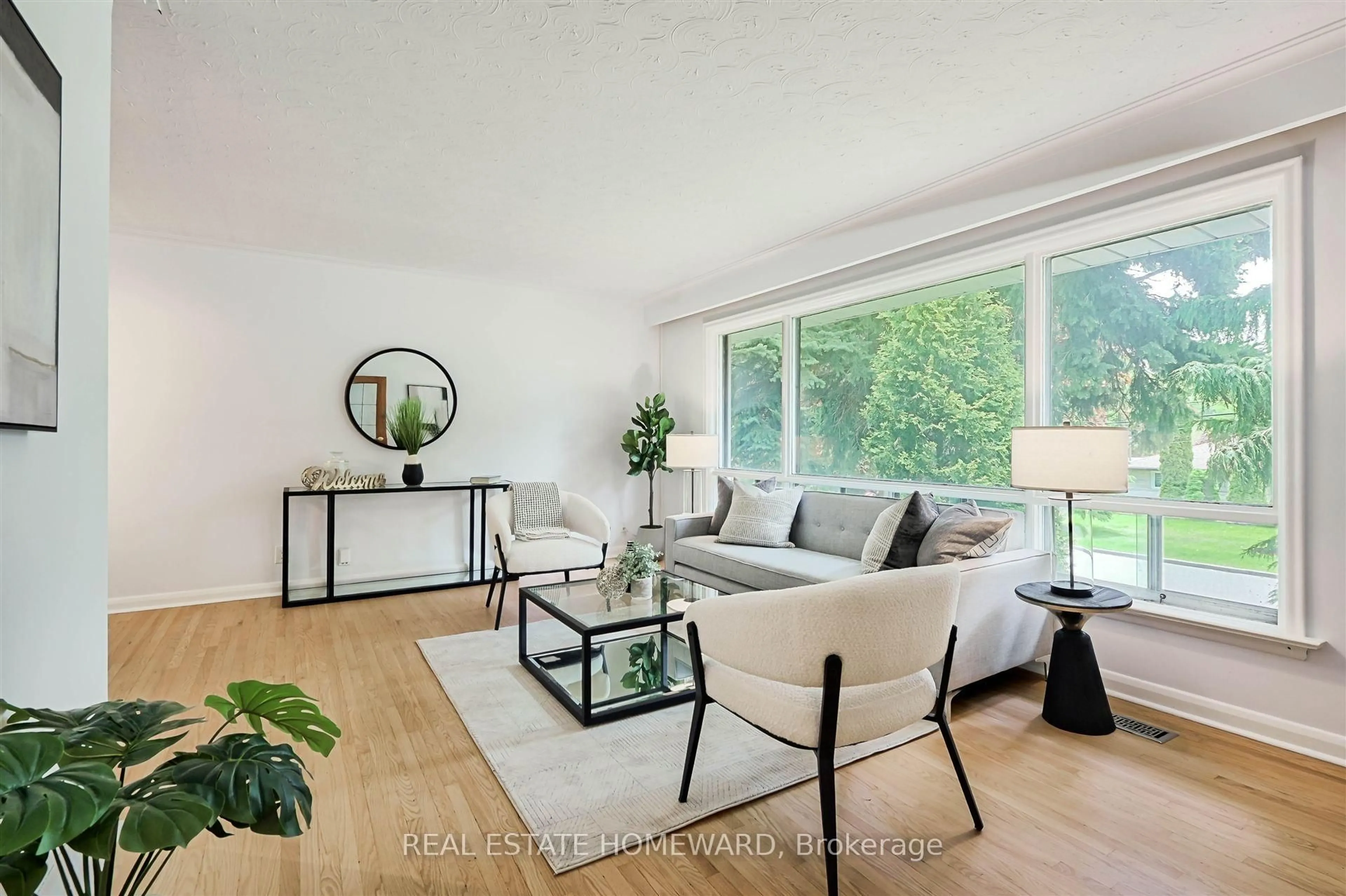 Living room with furniture, wood/laminate floor for 8 Burnview Cres, Toronto Ontario M1H 1B5