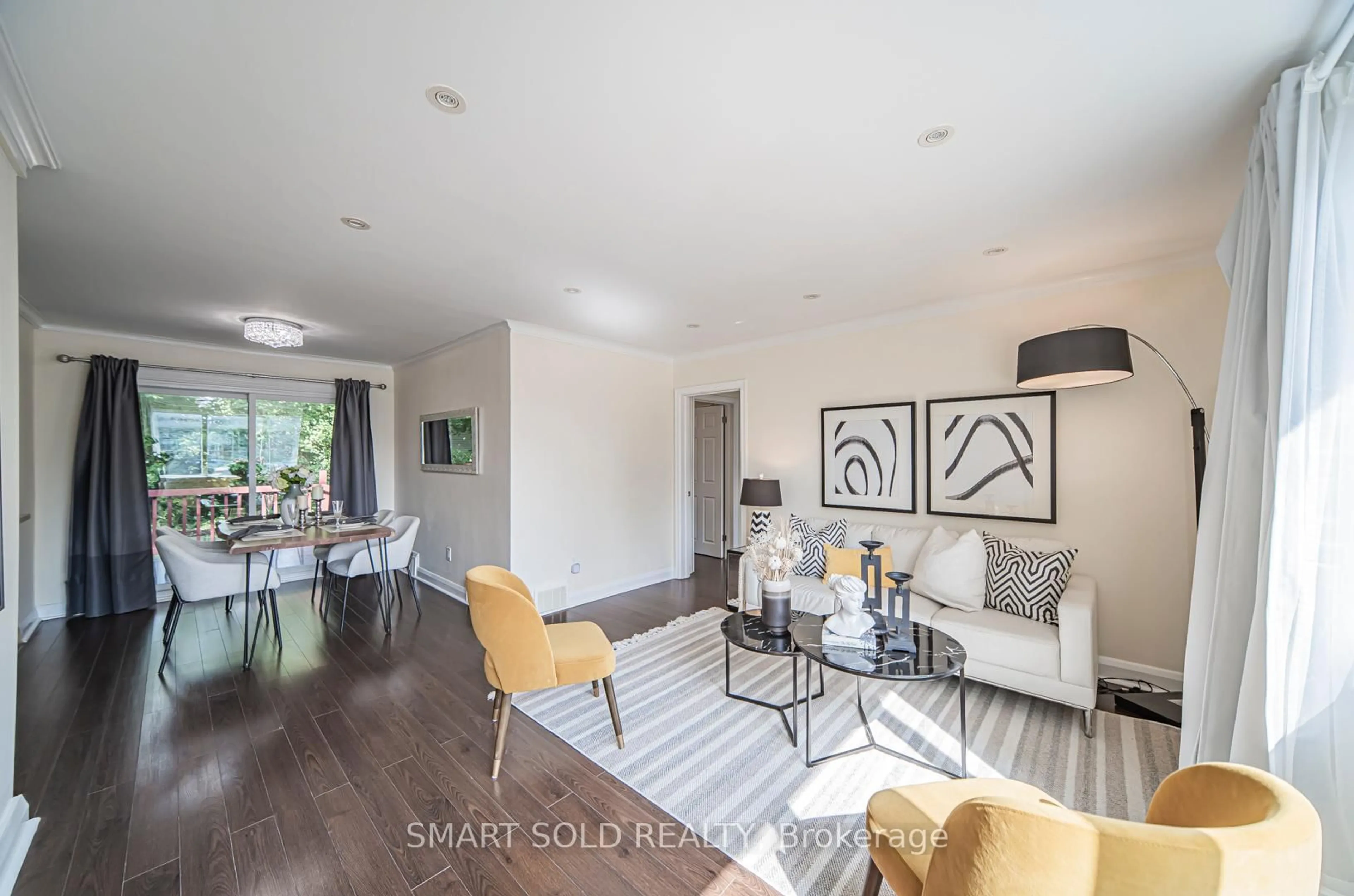 Living room with furniture, wood/laminate floor for 2202 Kennedy Rd, Toronto Ontario M1T 3G4
