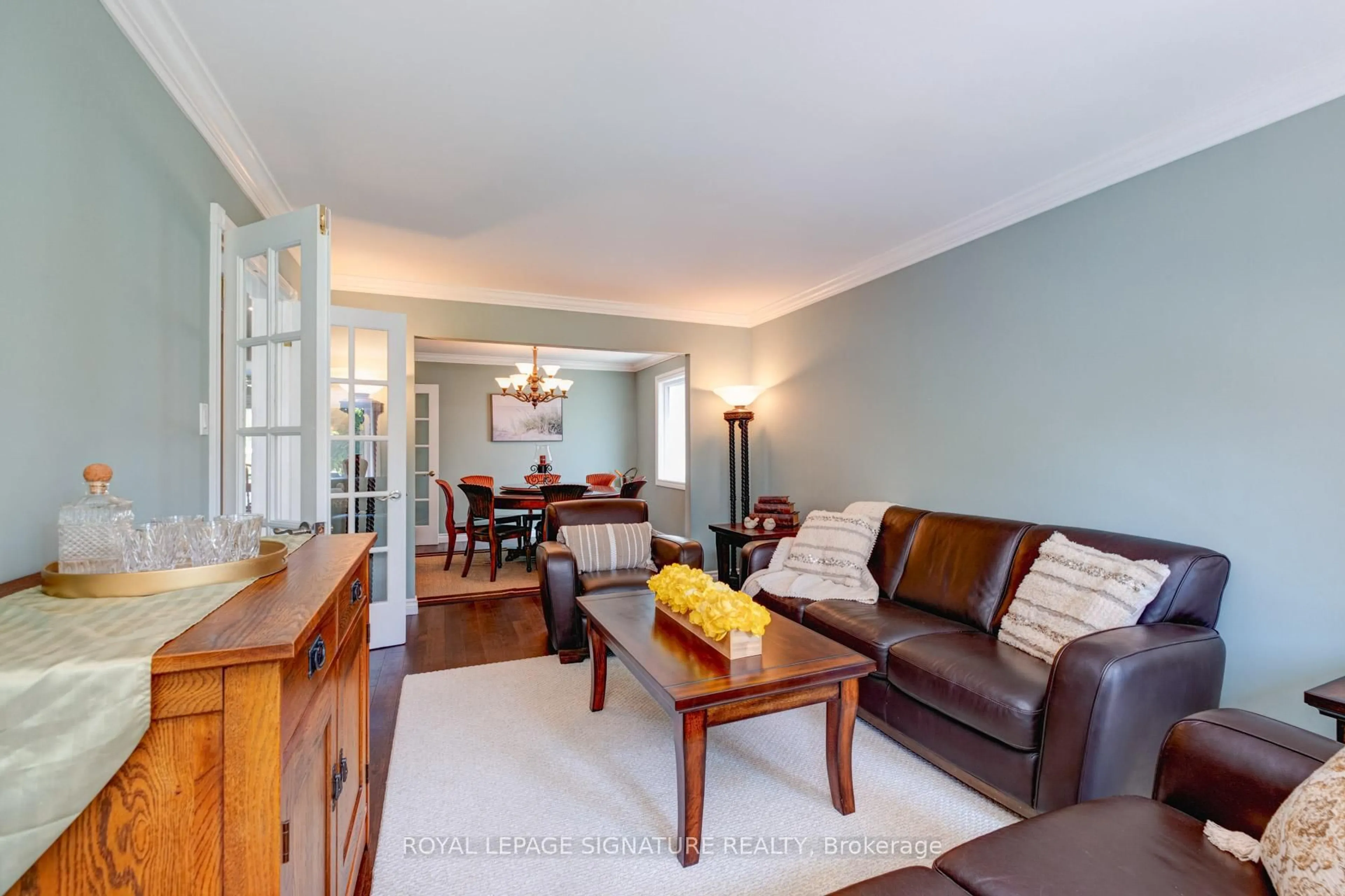 Living room with furniture, wood/laminate floor for 1405 Rougemount Dr, Pickering Ontario L1V 1N2