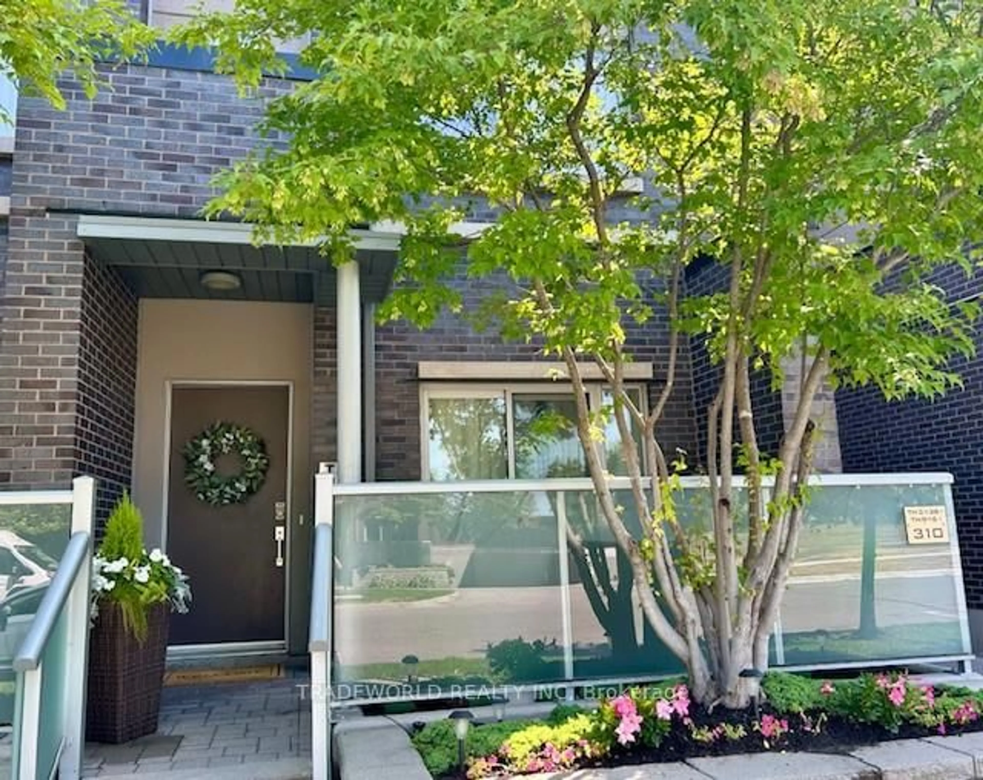 Home with brick exterior material, street for 310 Village Green Sq #TH#38, Toronto Ontario M1S 0L1