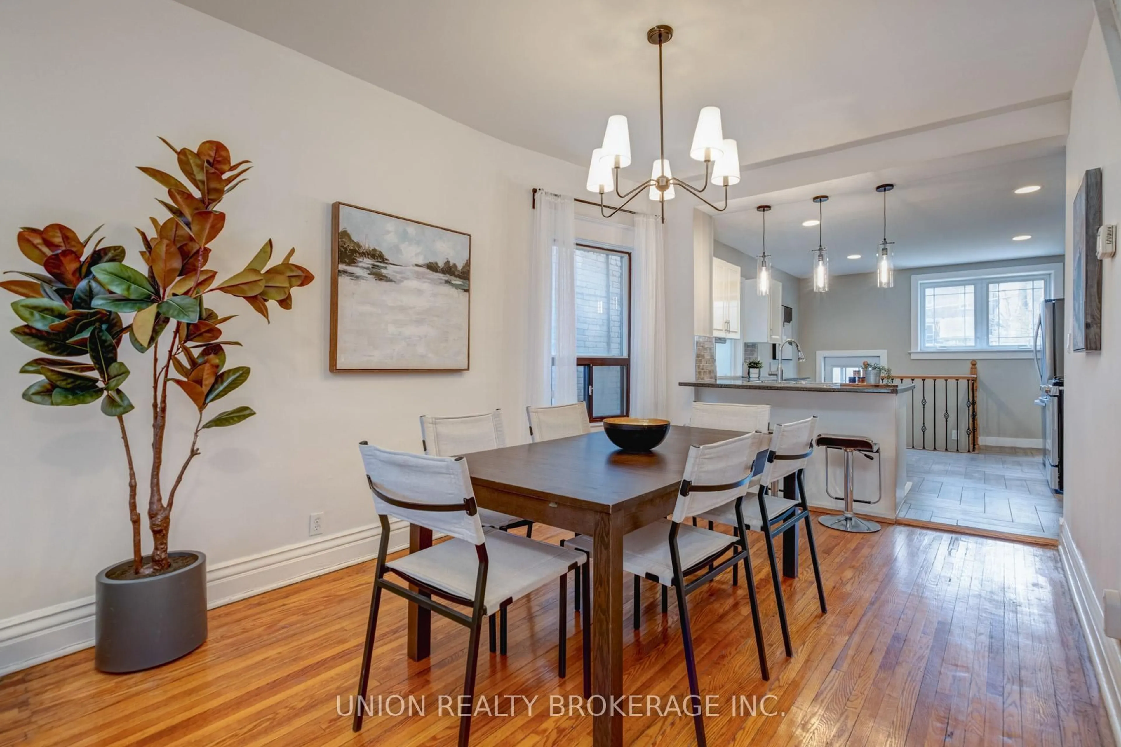 Dining room, wood/laminate floor for 146 Beech Ave, Toronto Ontario M4E 3H6