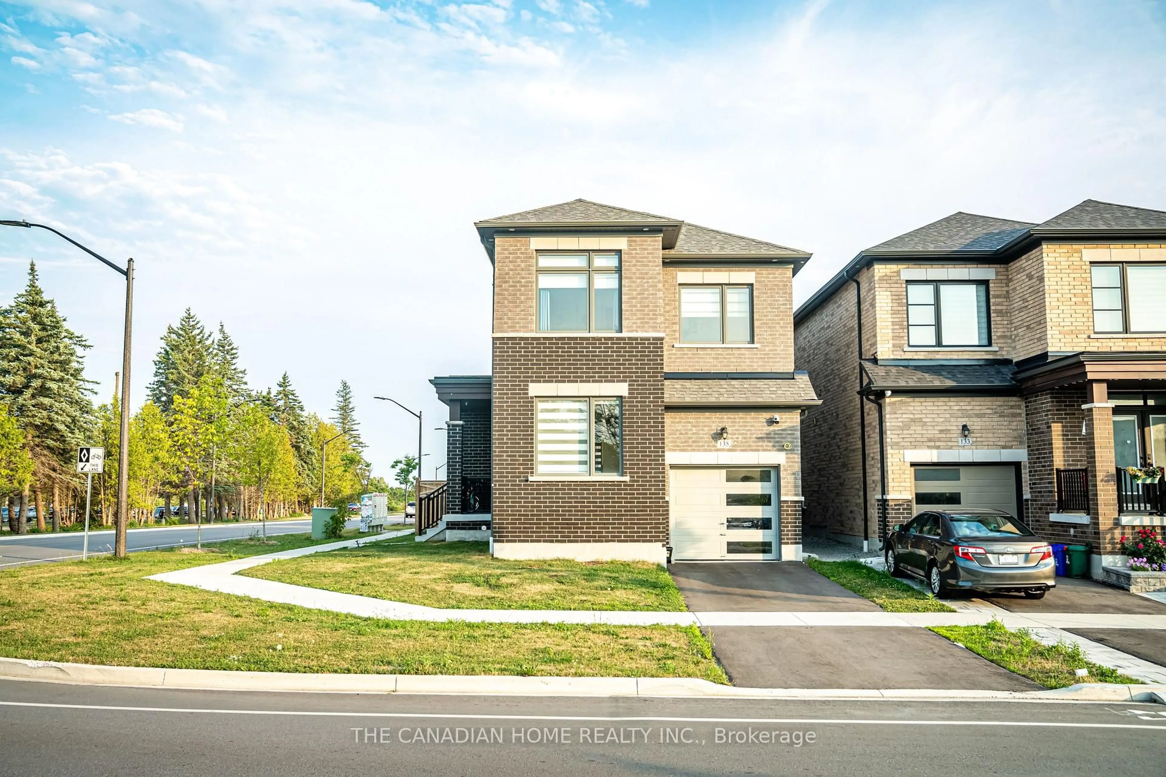 Home with brick exterior material, street for 135 Micklefield Ave, Whitby Ontario L1P 0L3