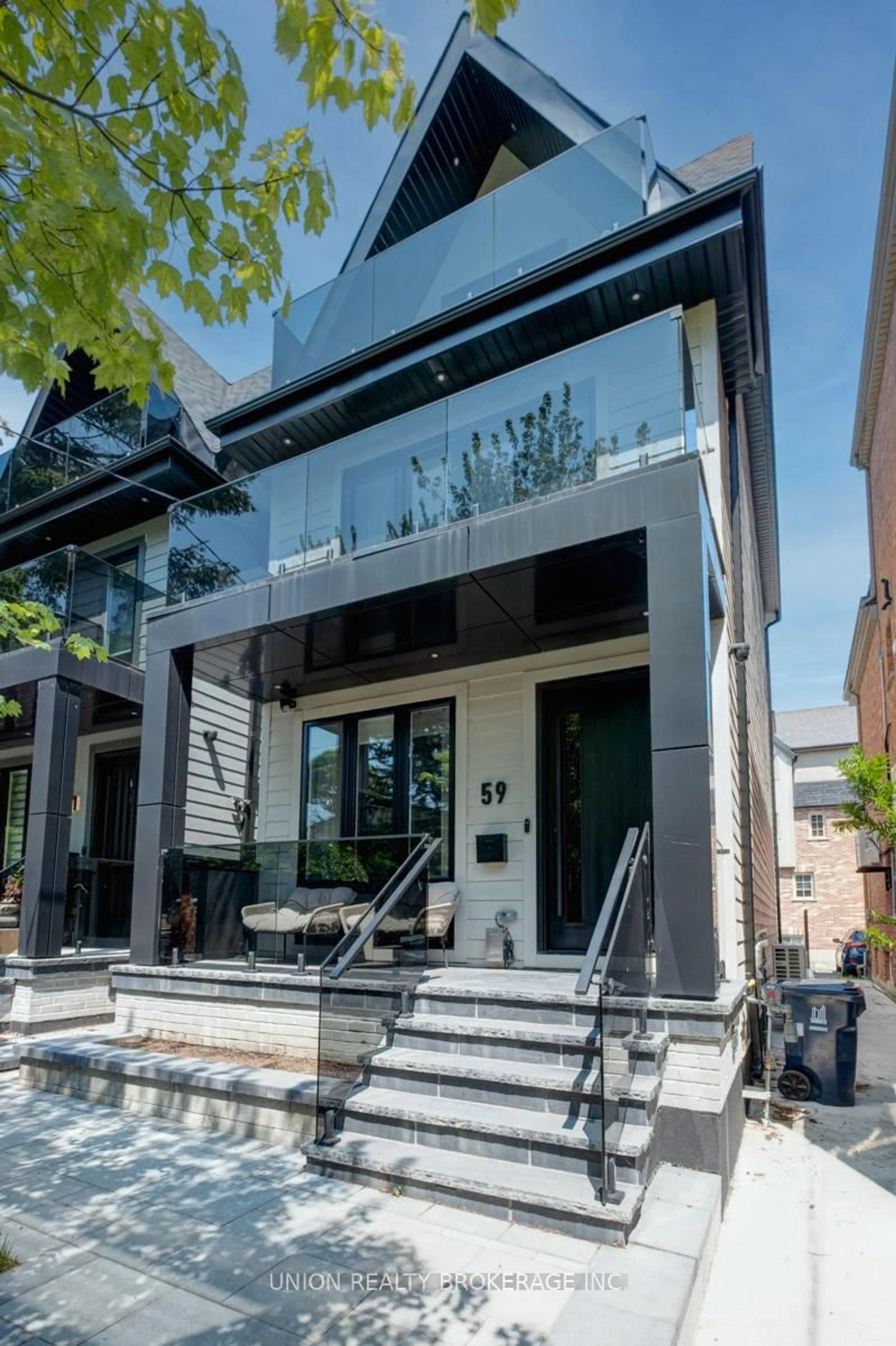 Home with brick exterior material, street for 59 Glen Manor Dr, Toronto Ontario M4E 2X5