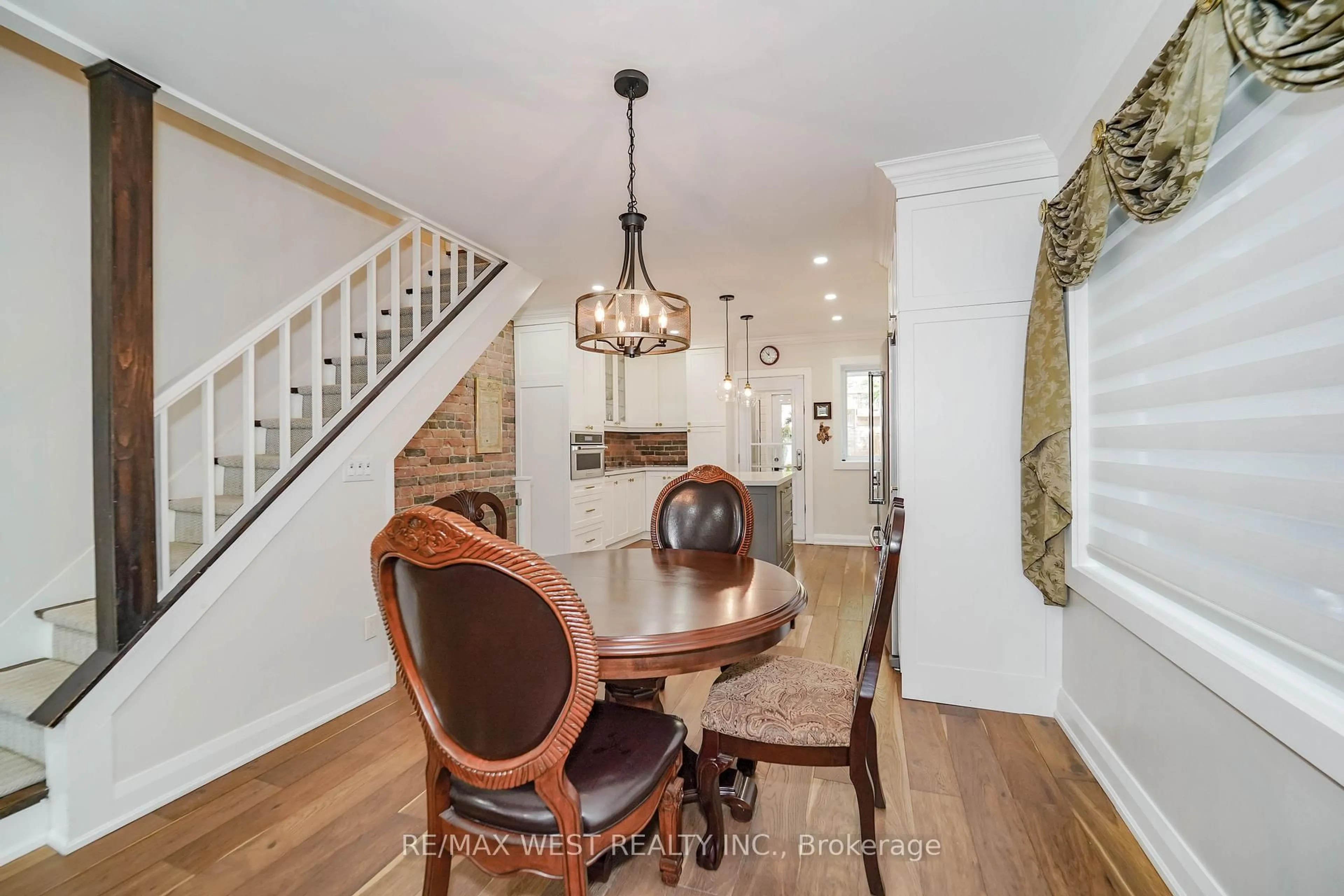 Dining room, wood/laminate floor for 46 Rhyl Ave, Toronto Ontario M4L 1R9