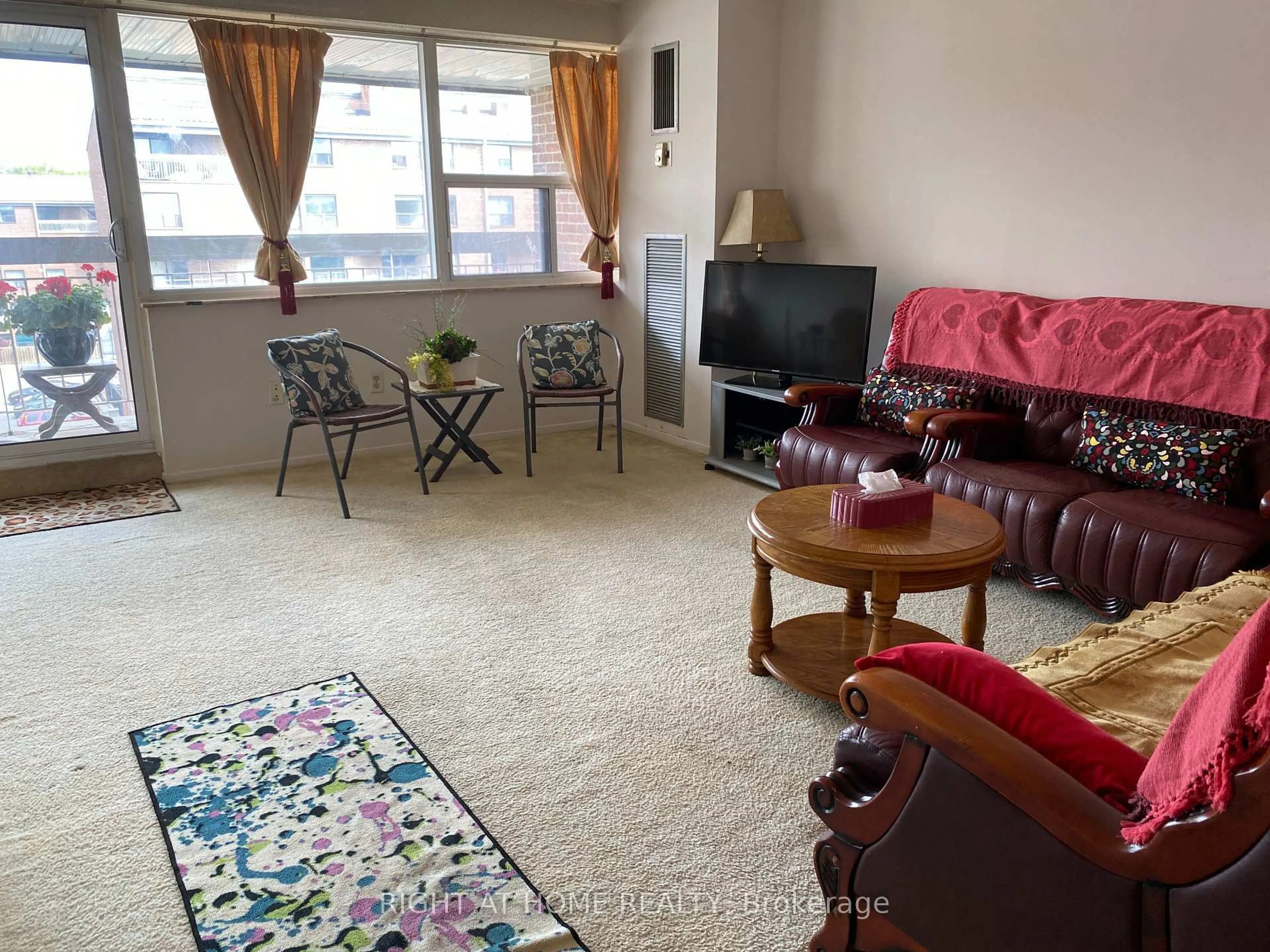 Living room with furniture, carpet floor for 4060 Lawrence Ave #505, Toronto Ontario M1E 4V4