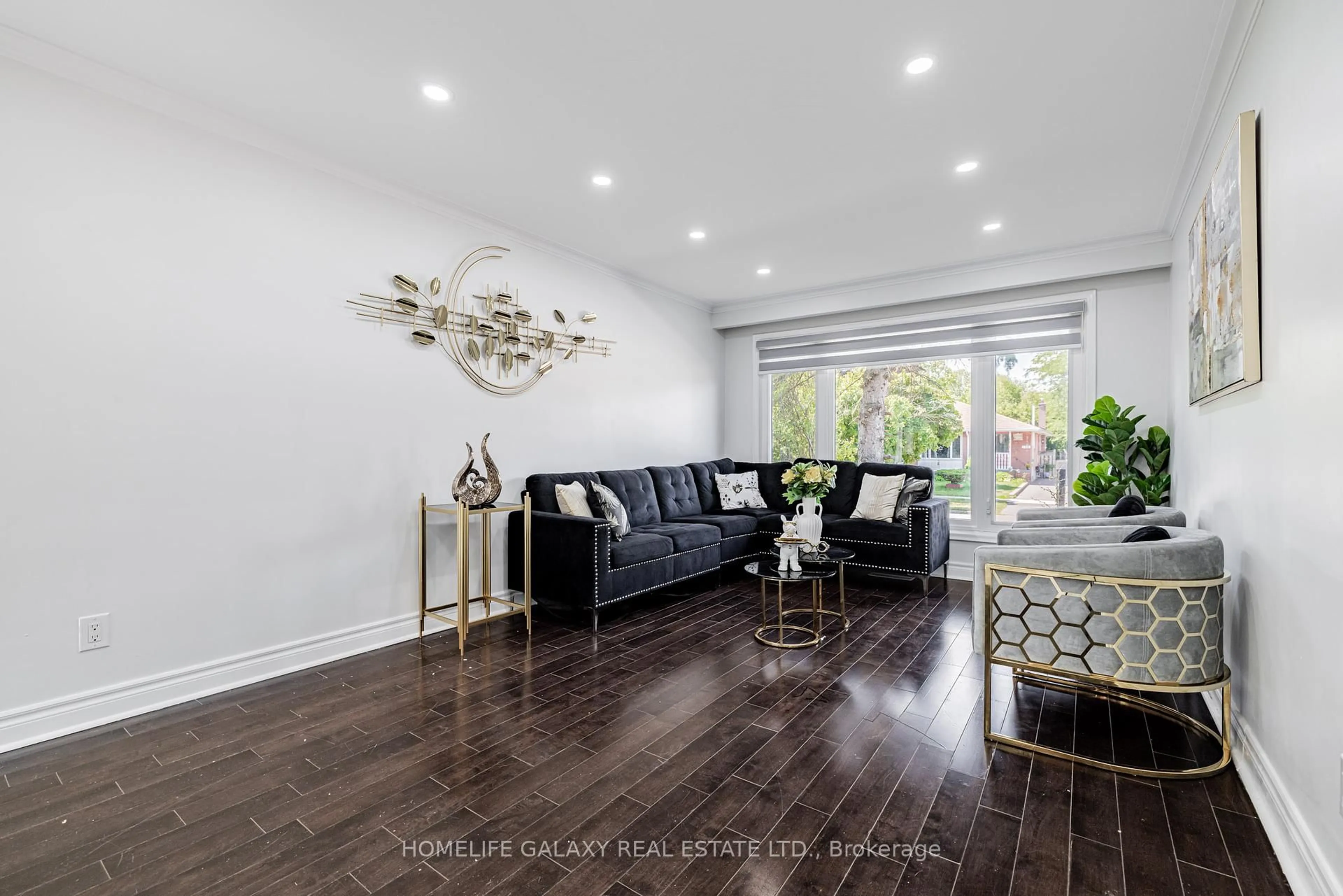 Living room with furniture, wood/laminate floor for 133 Lupin Dr, Whitby Ontario L1N 1X9