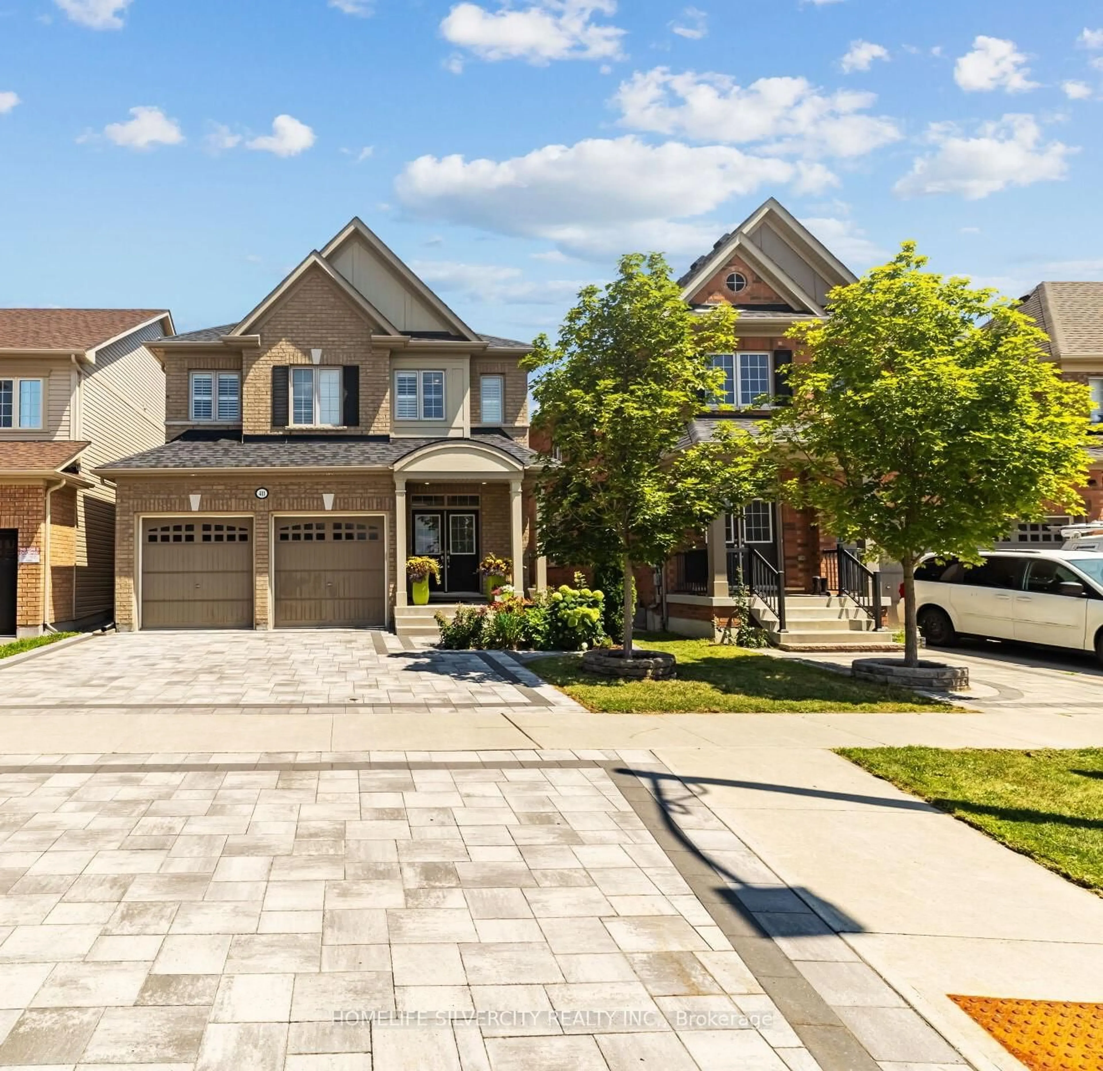 Home with brick exterior material, street for 411 Windfields Farm Dr, Oshawa Ontario L1L 0M1