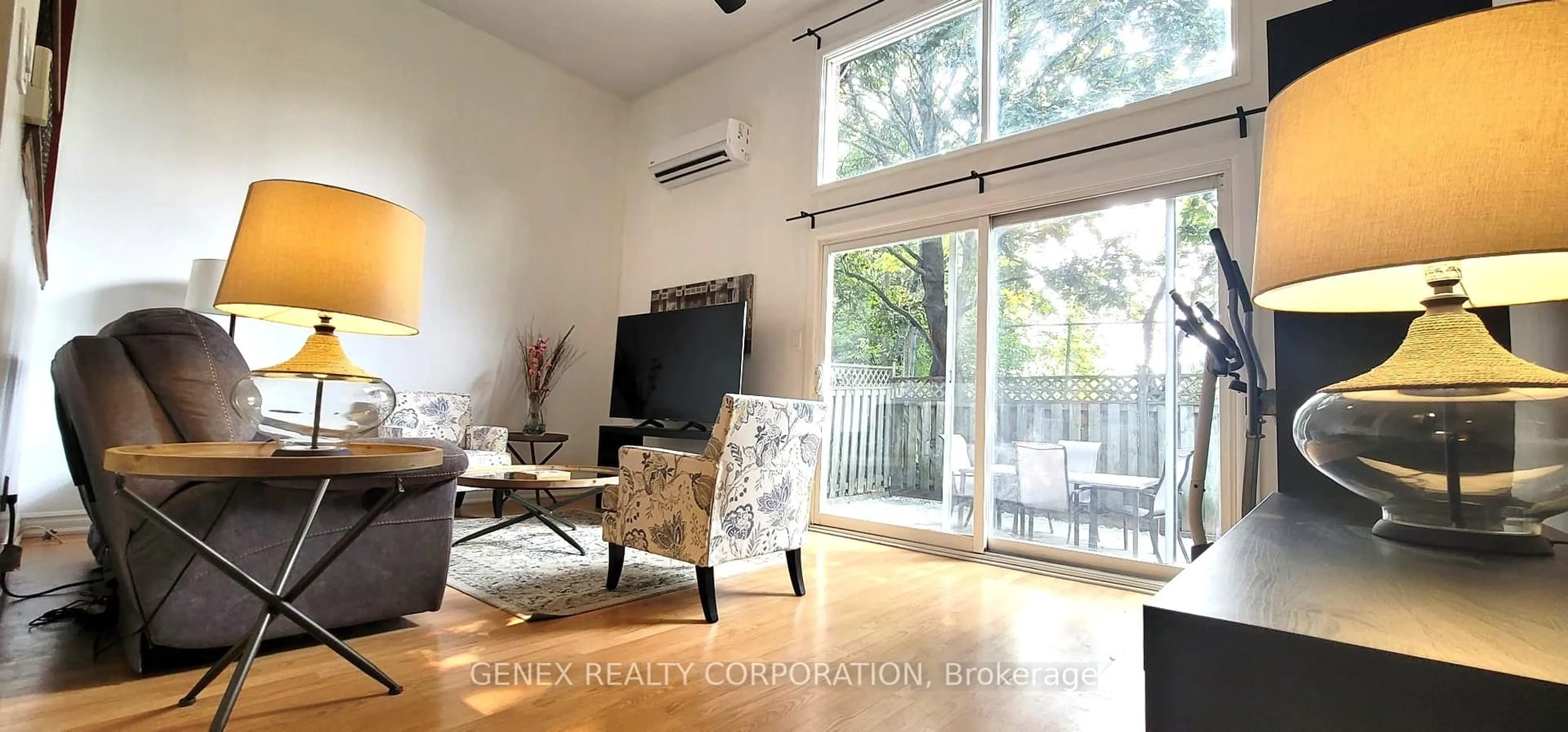 Living room with furniture, wood/laminate floor for 3100 Kingston Rd #34, Toronto Ontario M1M 3T4