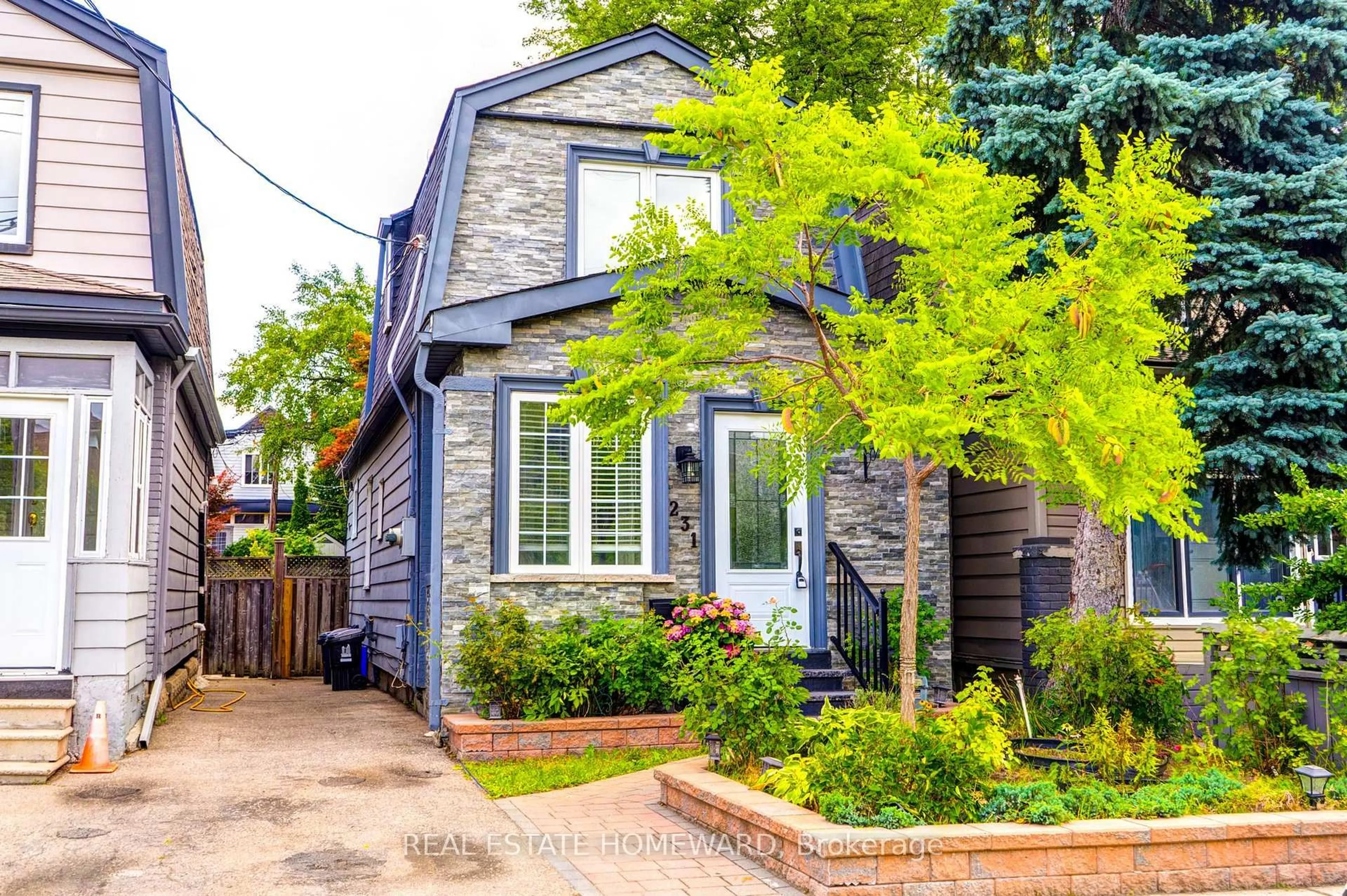 Home with brick exterior material, street for 231 Donlands Ave, Toronto Ontario M4J 3P9
