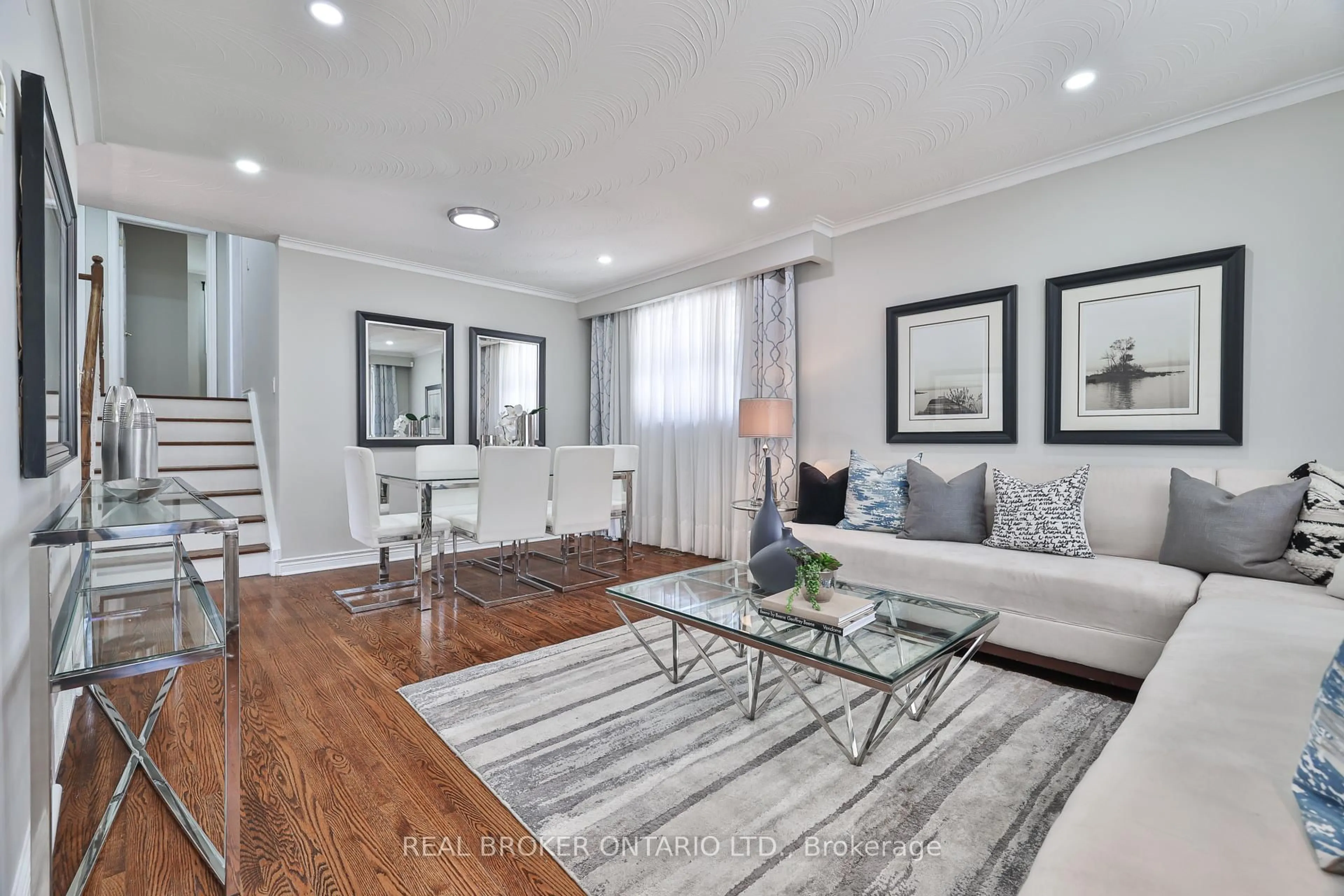 Living room with furniture, wood/laminate floor for 34 Alpaca Dr, Toronto Ontario M1J 2Z7