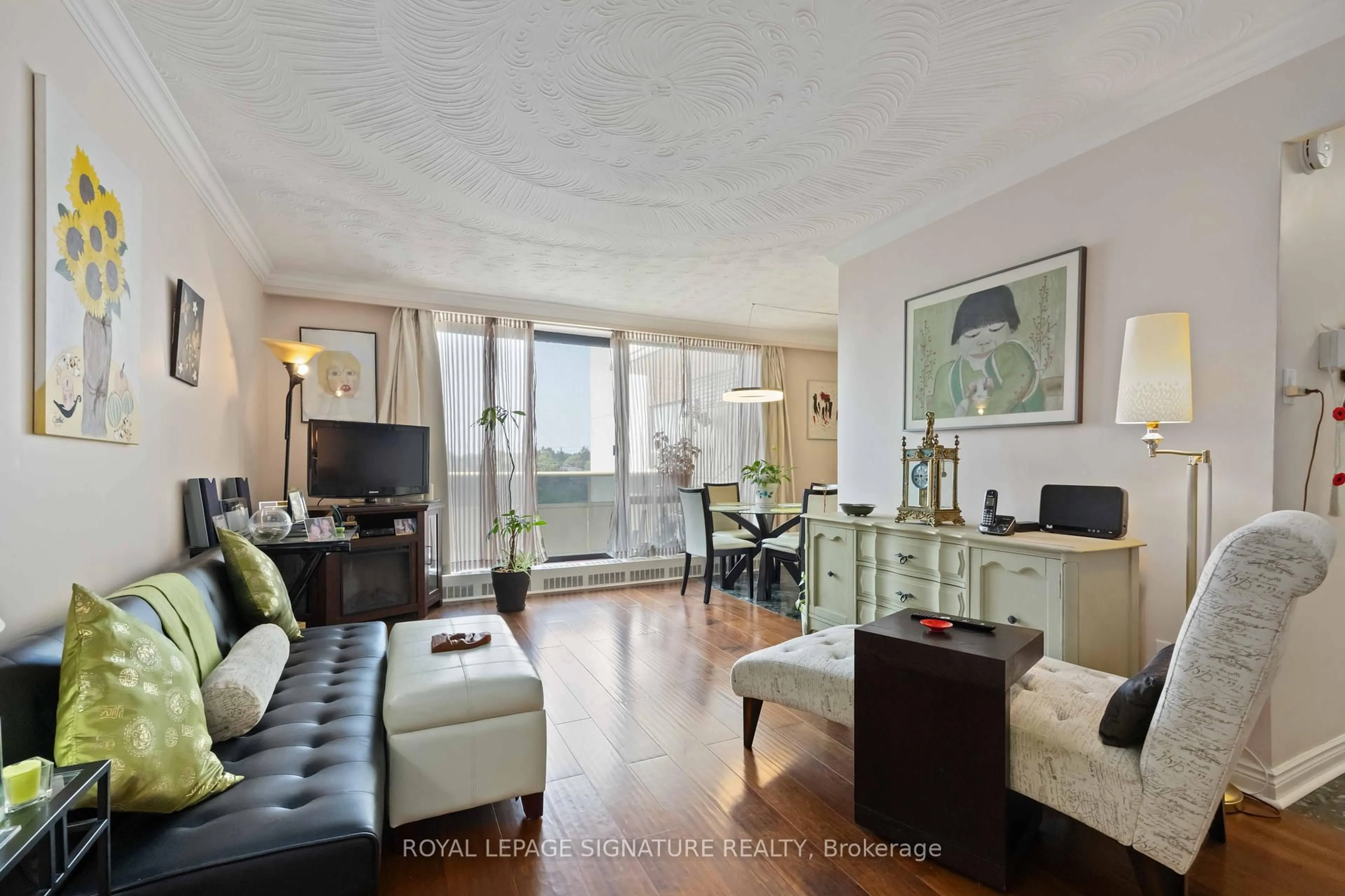 Living room with furniture, wood/laminate floor for 921 Midland Ave #502, Toronto Ontario M1K 4G2