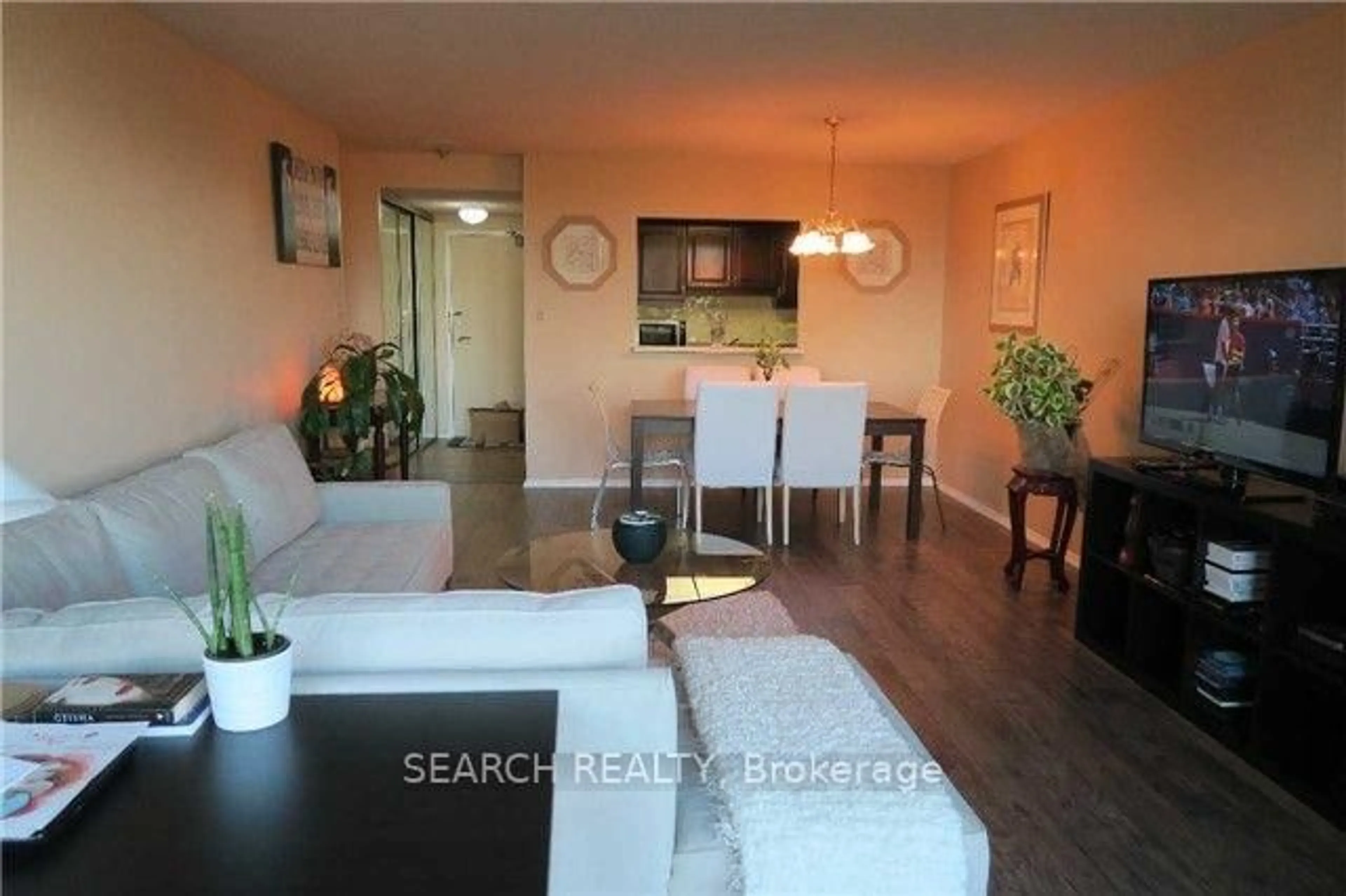 Living room with furniture, wood/laminate floor for 20 Dean Park Rd #312, Toronto Ontario M1B 3G9
