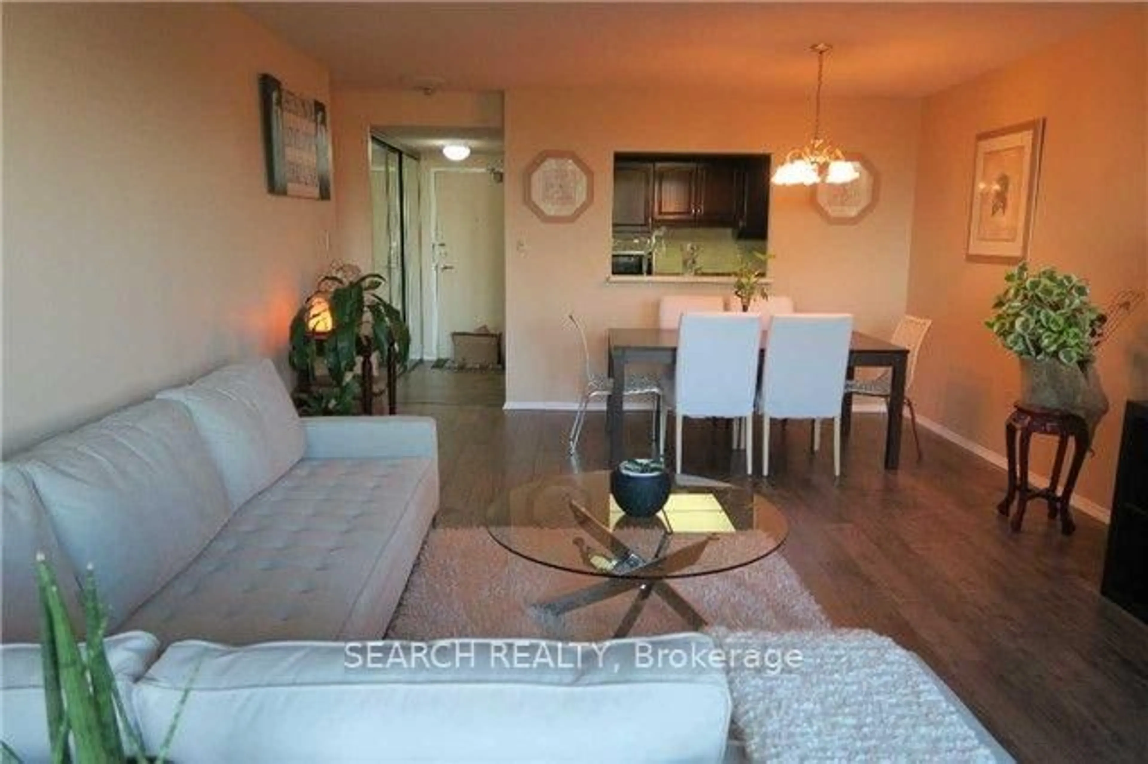 Living room with furniture, wood/laminate floor for 20 Dean Park Rd #312, Toronto Ontario M1B 3G9