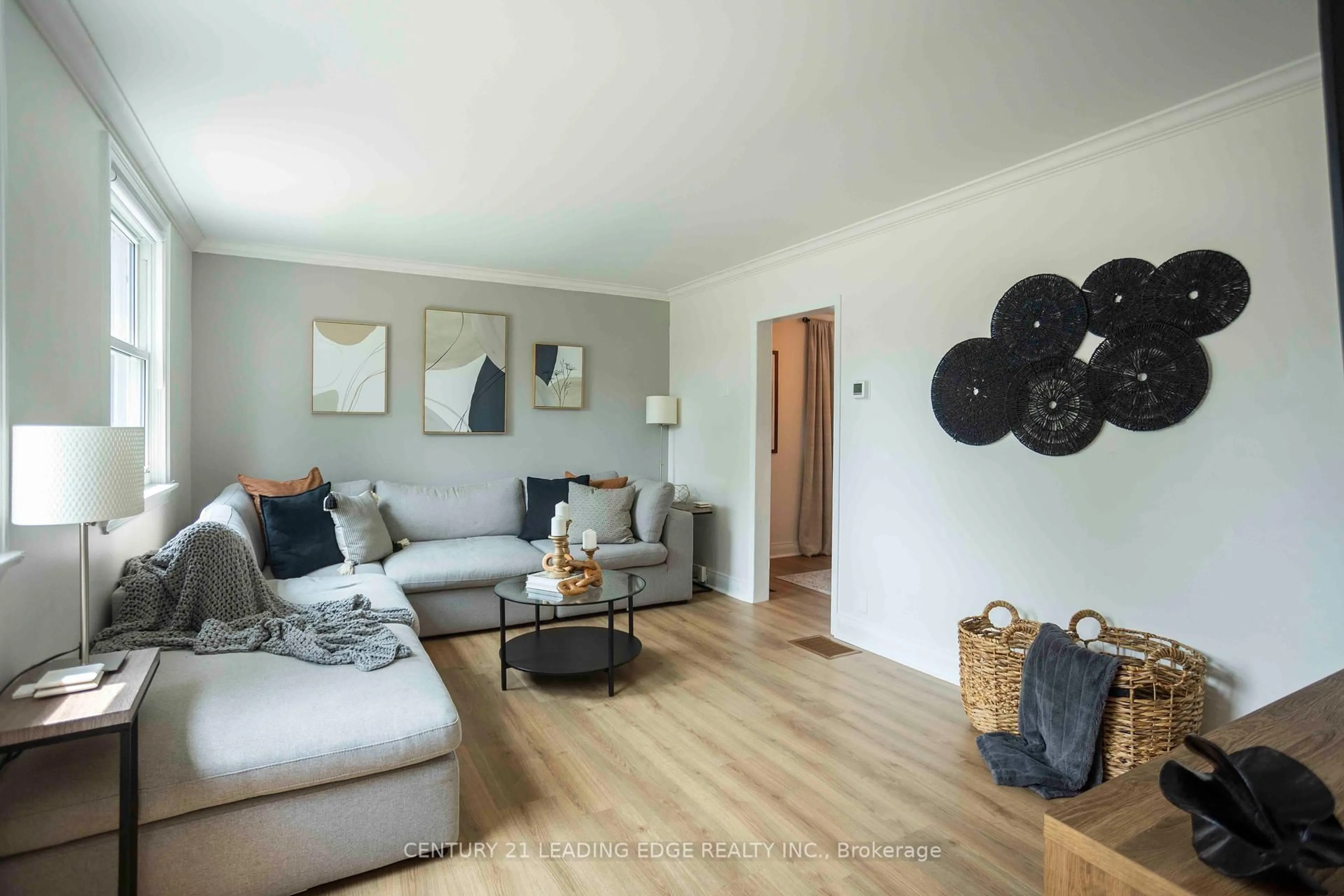 Living room with furniture, wood/laminate floor for 394 Beverly St, Oshawa Ontario L1G 1P6