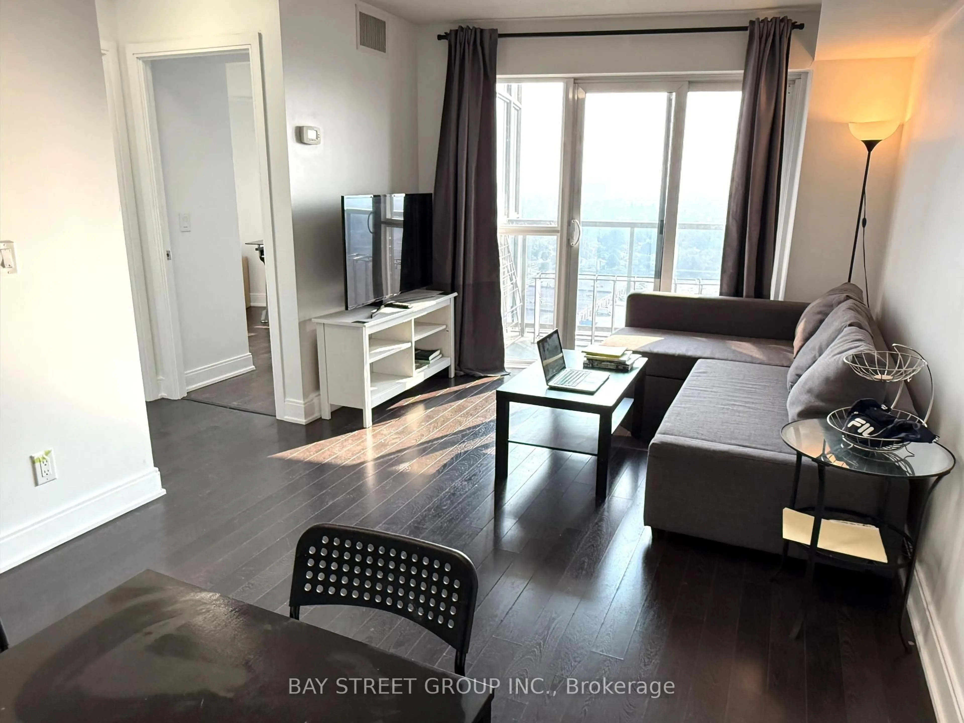 Living room with furniture, wood/laminate floor for 135 Village Green Sq #2325, Toronto Ontario M1S 0G4