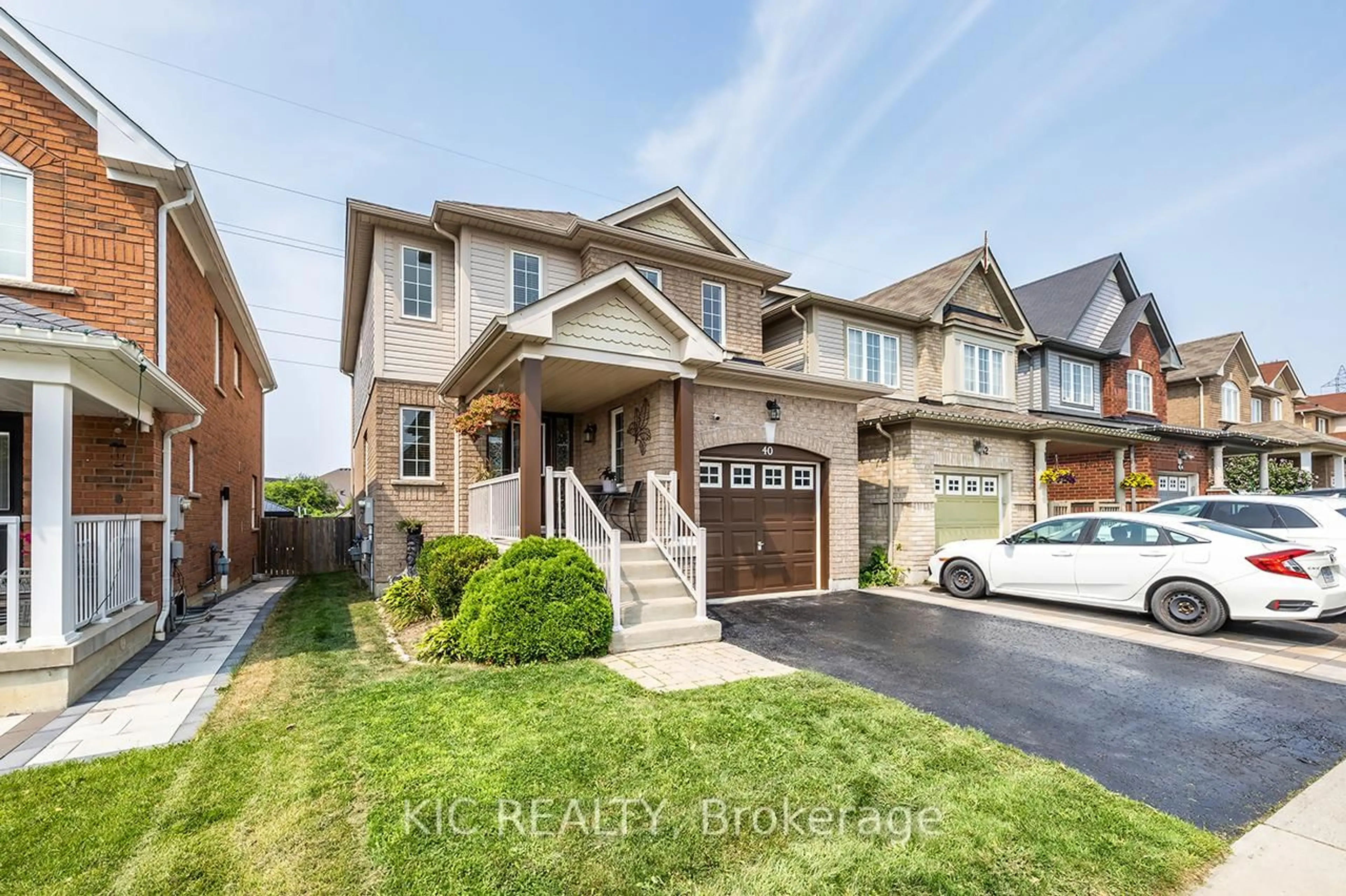 Home with brick exterior material, street for 40 Puttingedge Dr, Whitby Ontario L1R 0H7