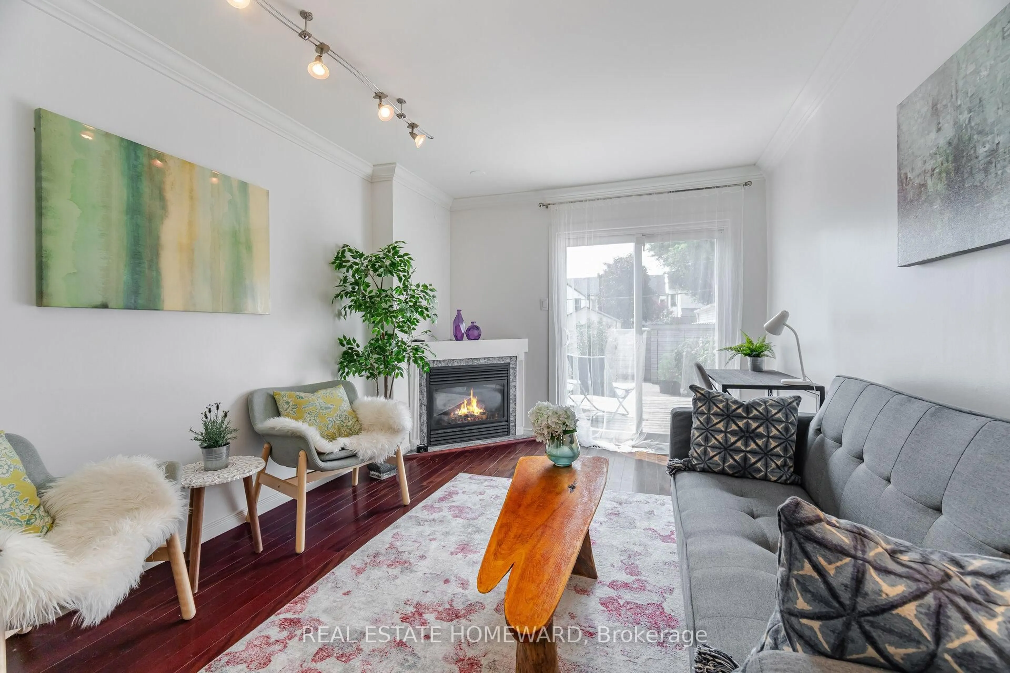 Living room with furniture, wood/laminate floor for 164 Morse St, Toronto Ontario M4M 2P8