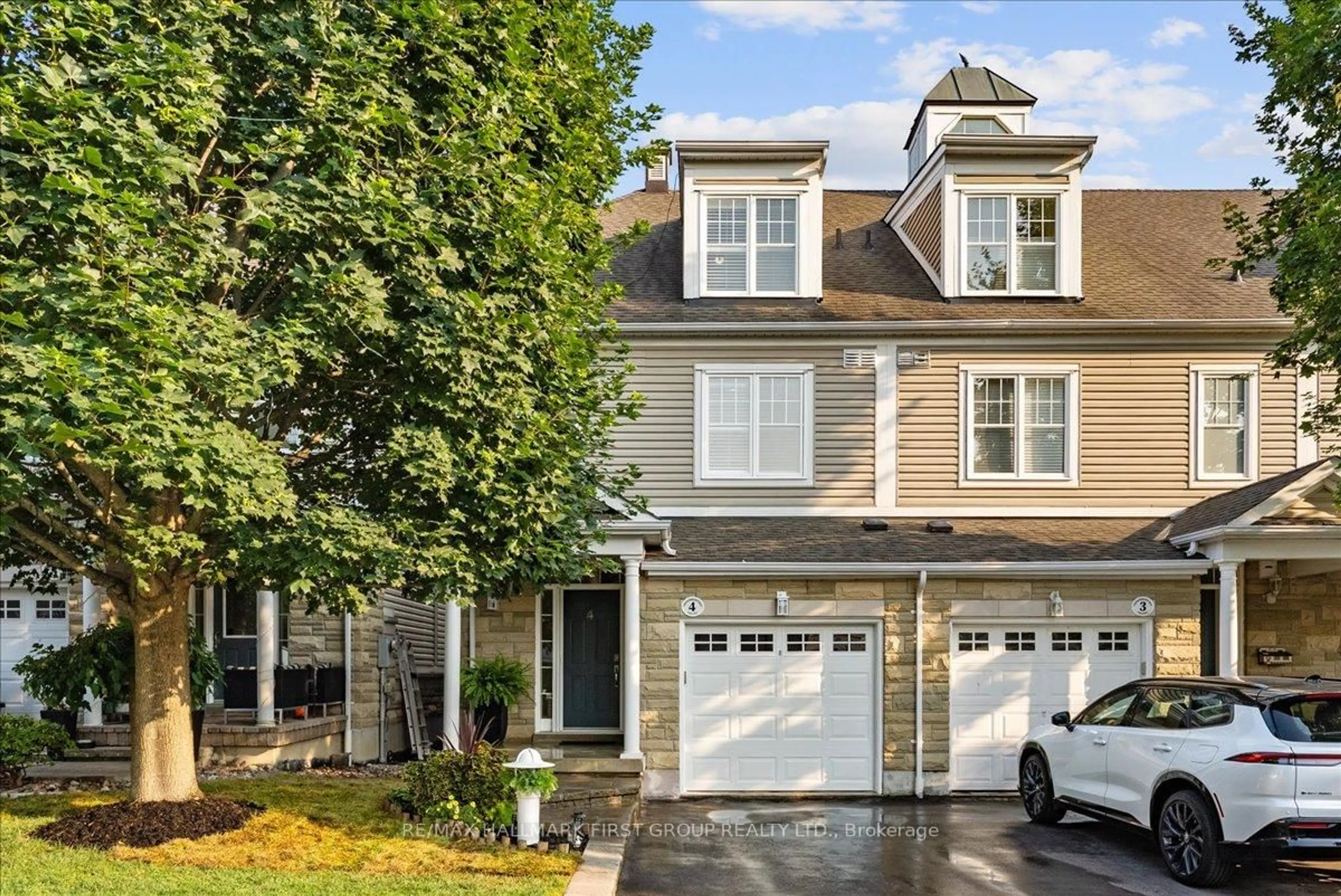 Home with vinyl exterior material, street for 1295 Wharf St #4, Pickering Ontario L1W 1A2