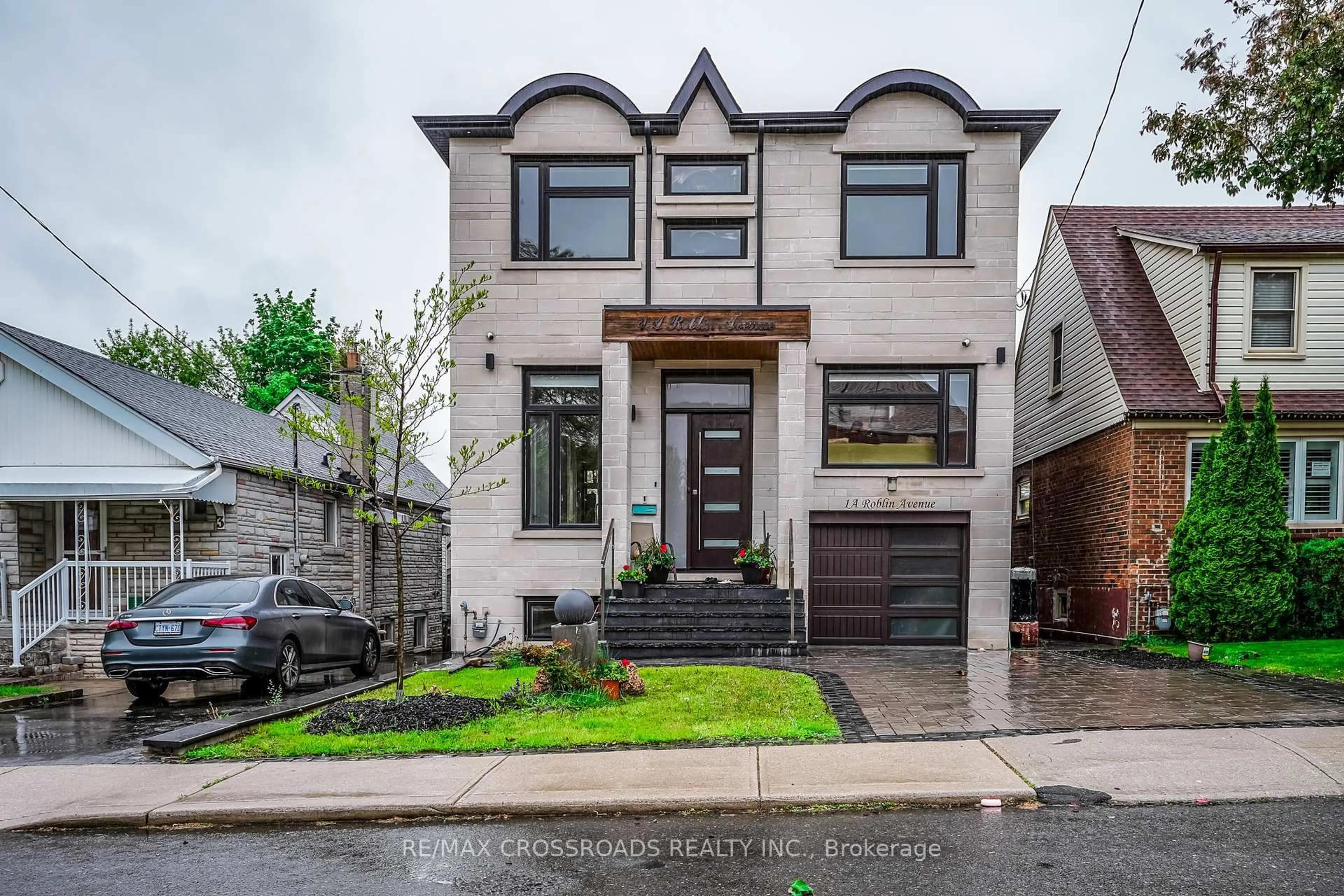 Home with brick exterior material, street for 1A Roblin Ave, Toronto Ontario M4C 3P7
