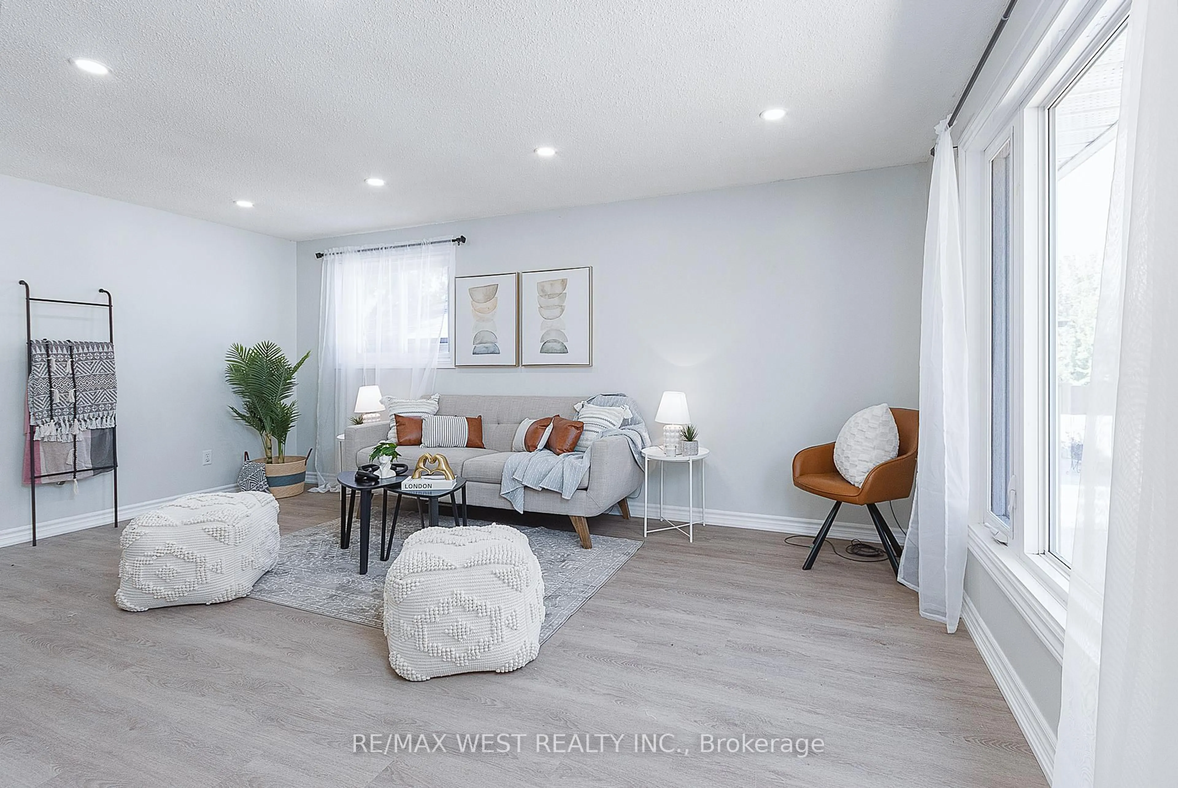 Living room with furniture, wood/laminate floor for 1153 Norman Cres, Oshawa Ontario L1H 7W9