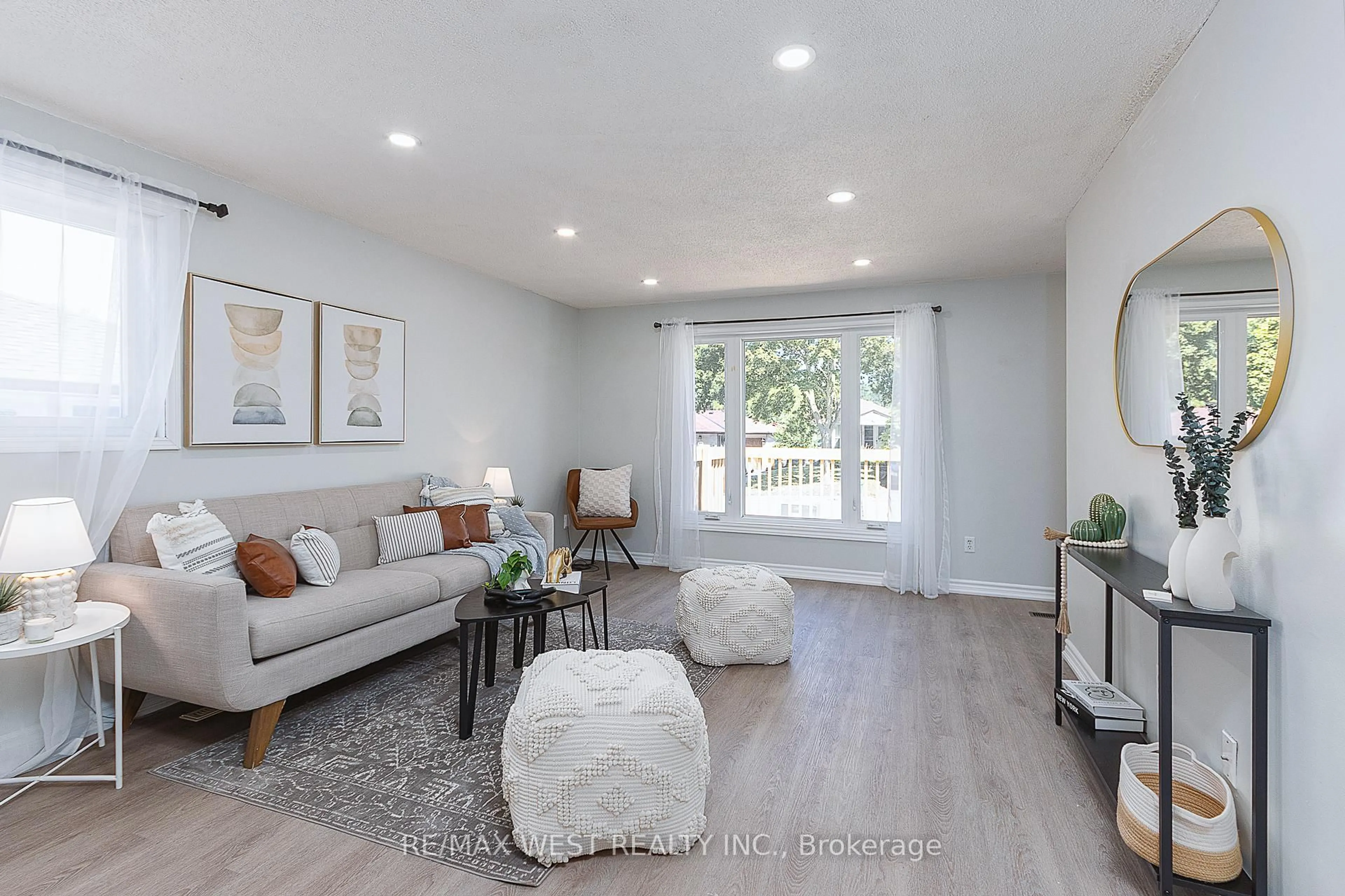 Living room with furniture, wood/laminate floor for 1153 Norman Cres, Oshawa Ontario L1H 7W9