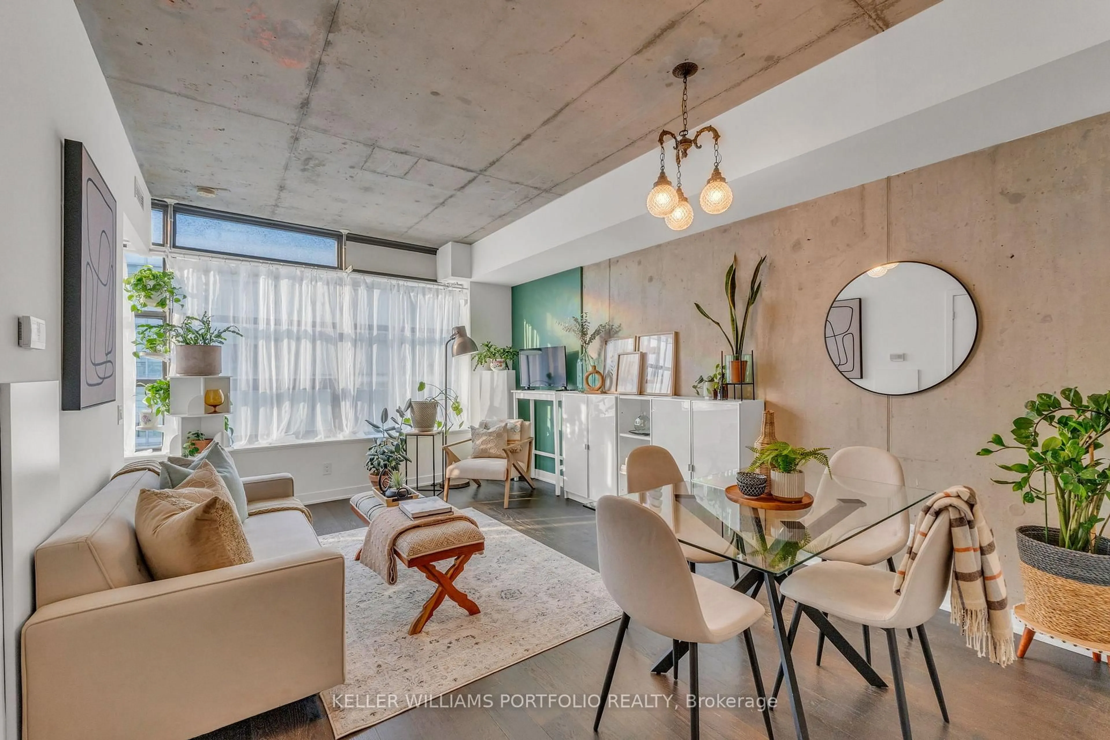 Living room with furniture, cement floor for 1201 Dundas St #706, Toronto Ontario M4M 1S2